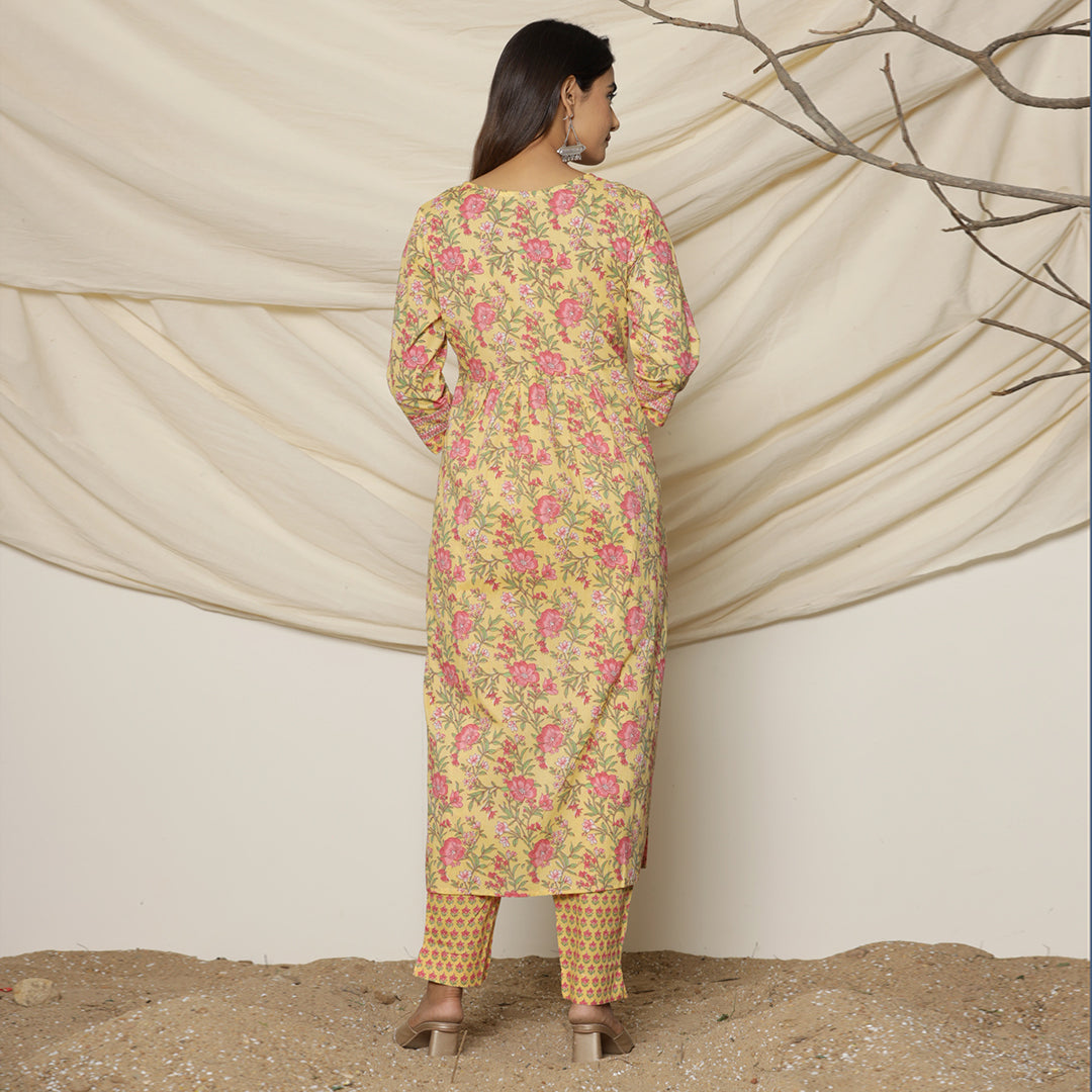 Back view of theYellow Lily Printed Cotton Suit by cottons daily worn by the model.
