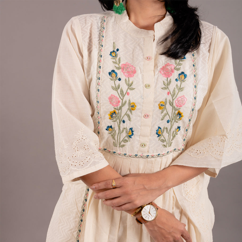 Close-up of the floral embroidered front design on the Off White Floral Cotton Suit's French collar kurta, showcasing intricate craftsmanship.