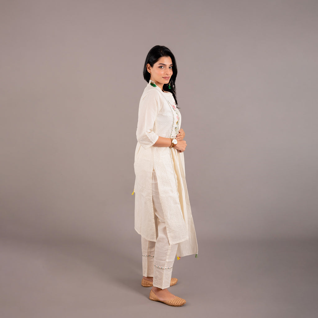Detailed view of the straight-fit pants from the Off White Floral Cotton Suit, highlighting the elegant embroidery work along the sides.