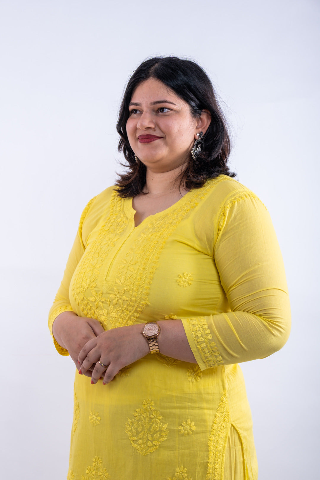 Side profile of the fluorescent yellow hand-chikankari cotton co-ord set, highlighting the seamless integration of traditional chikankari patterns on the kurta and palazzo pants.