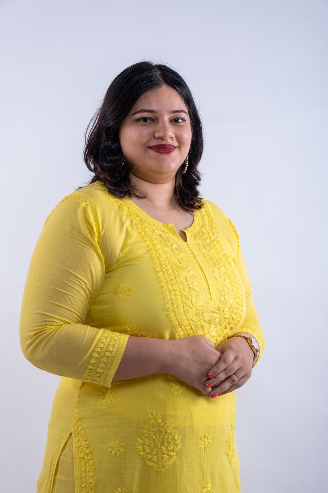 Detailed view of the cotton palazzo pants in the co-ord set, adorned with matching chikankari thread work, complementing the fluorescent yellow kurta.
