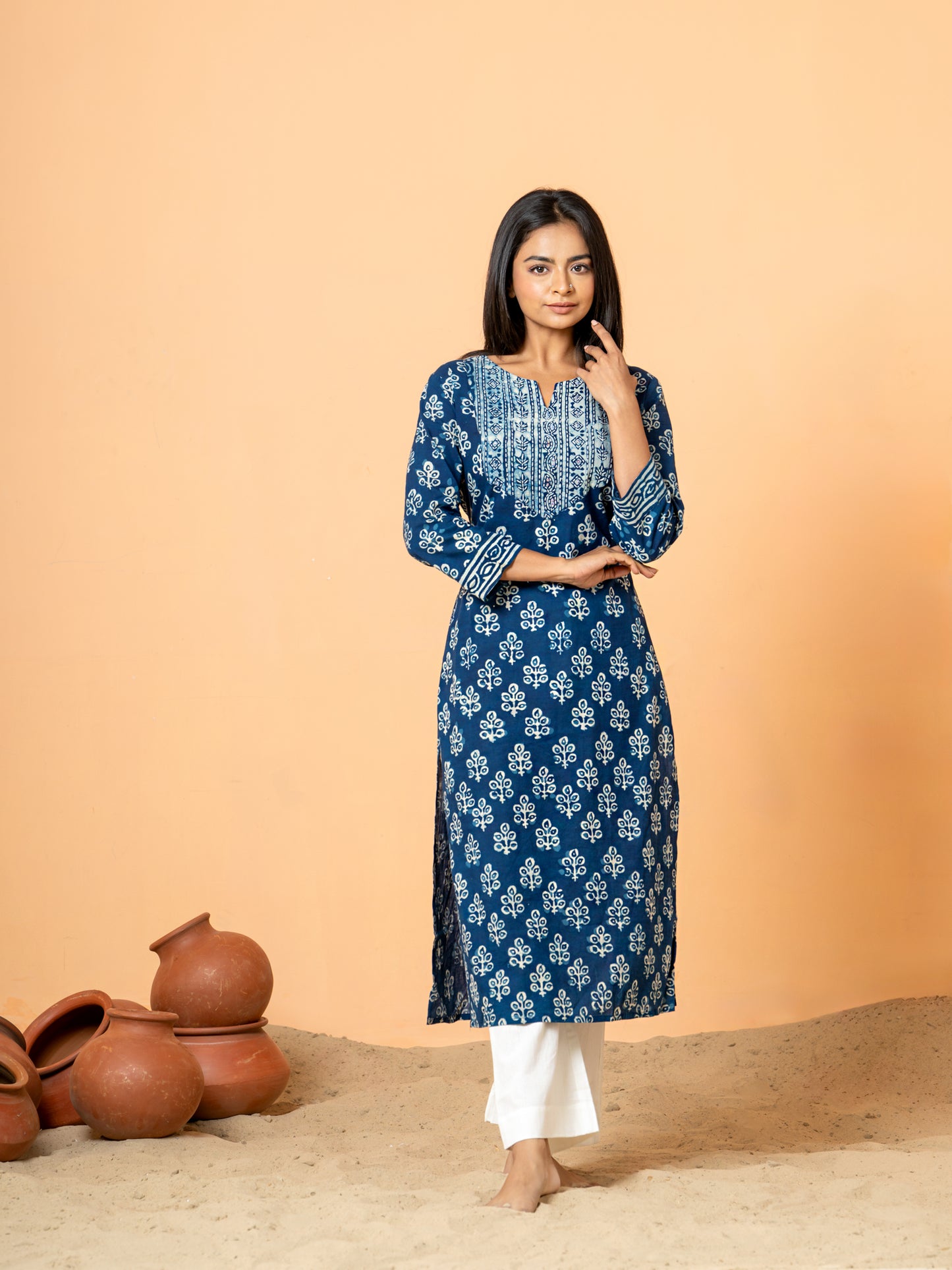 Full front view of the Indigo Peacock Feather Print Cotton Kurta for women, crafted from pure cotton with a striking peacock feather print and delicate sequence work, featuring a round V neck.