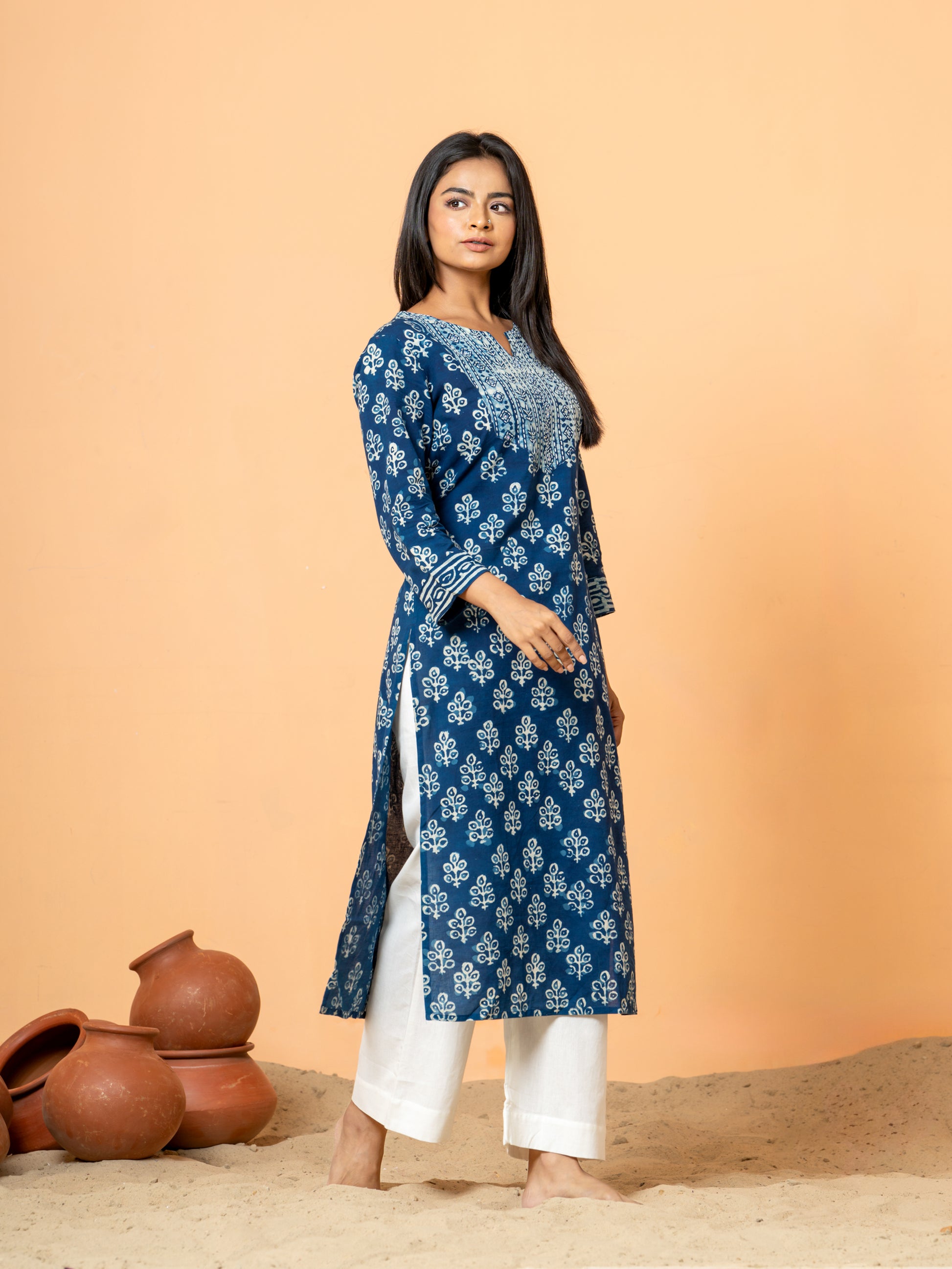 Stylish shot showing the Indigo Peacock Feather Print Cotton Kurta being worn, perfect for festive events or casual wear.