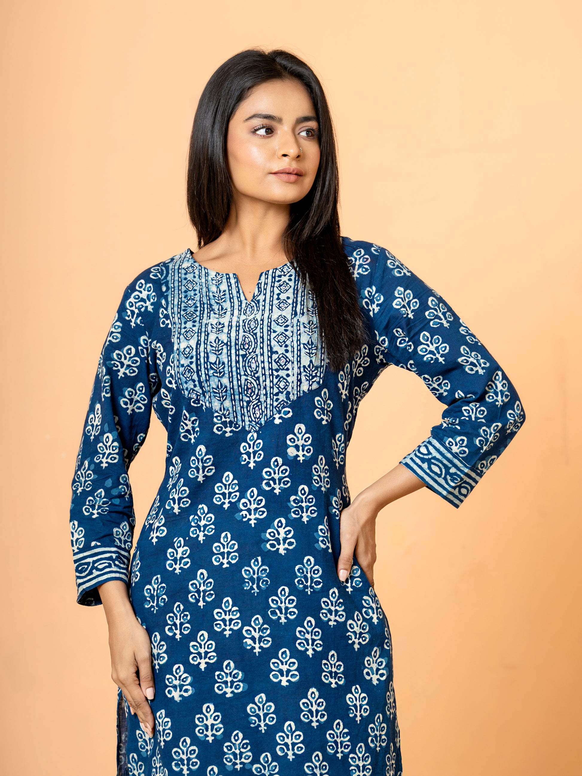 View showcasing the comfortable regular fit and 3/4th sleeves of the Indigo Peacock Feather Print Cotton Kurta.