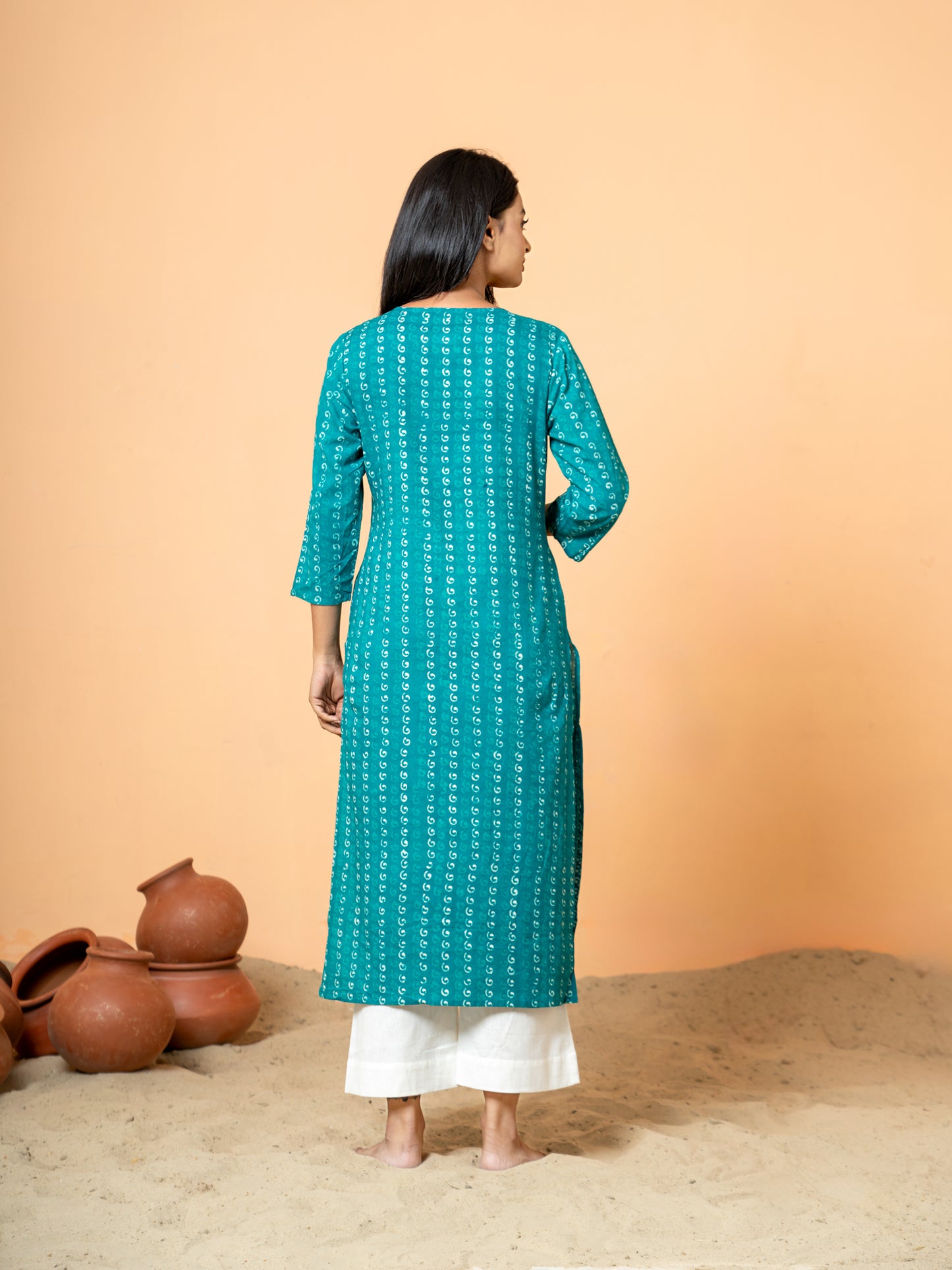 Back view showing the soft texture of the cotton fabric in a lovely sea green shade, with a hint of the pearl work detail.