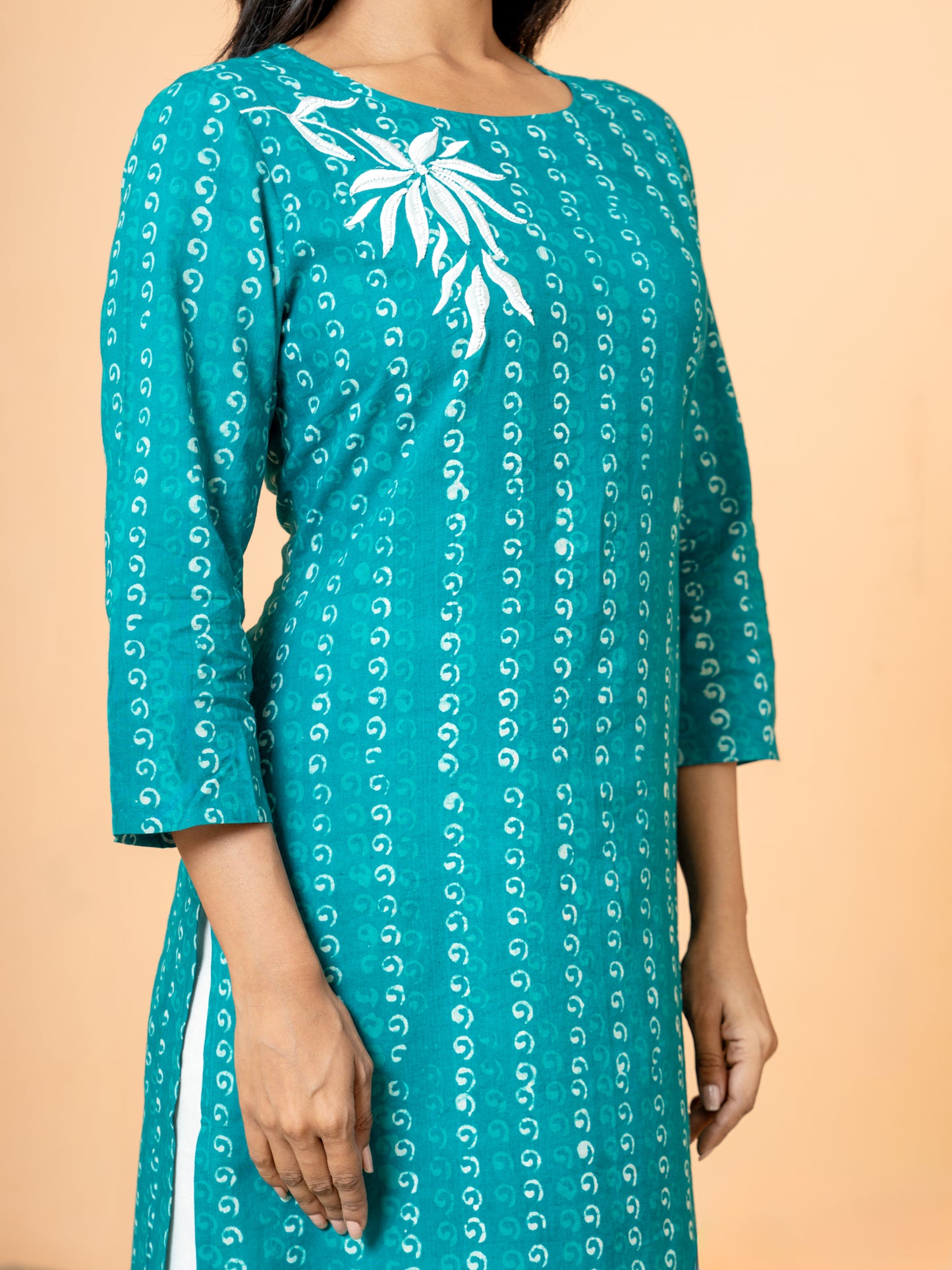 View of the hemline or sleeve edge of the Sea Green Cotton Kurta with Pearl Work, showing any finishing details or how the pearl work extends to the edges.
