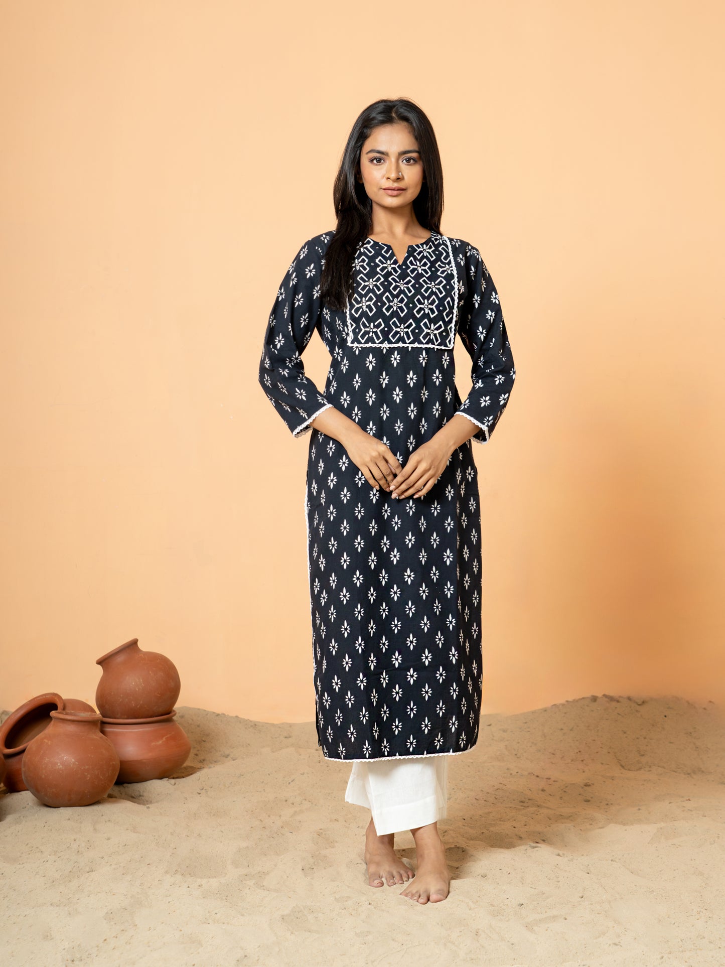 Full front view of the elegant Black Sequence Work Rangoli Cotton Kurta for women, showcasing the intricate rangoli print, delicate lace, and sequence detailing on breathable pure cotton fabric, featuring a Round V Neck and 3/4th sleeves.