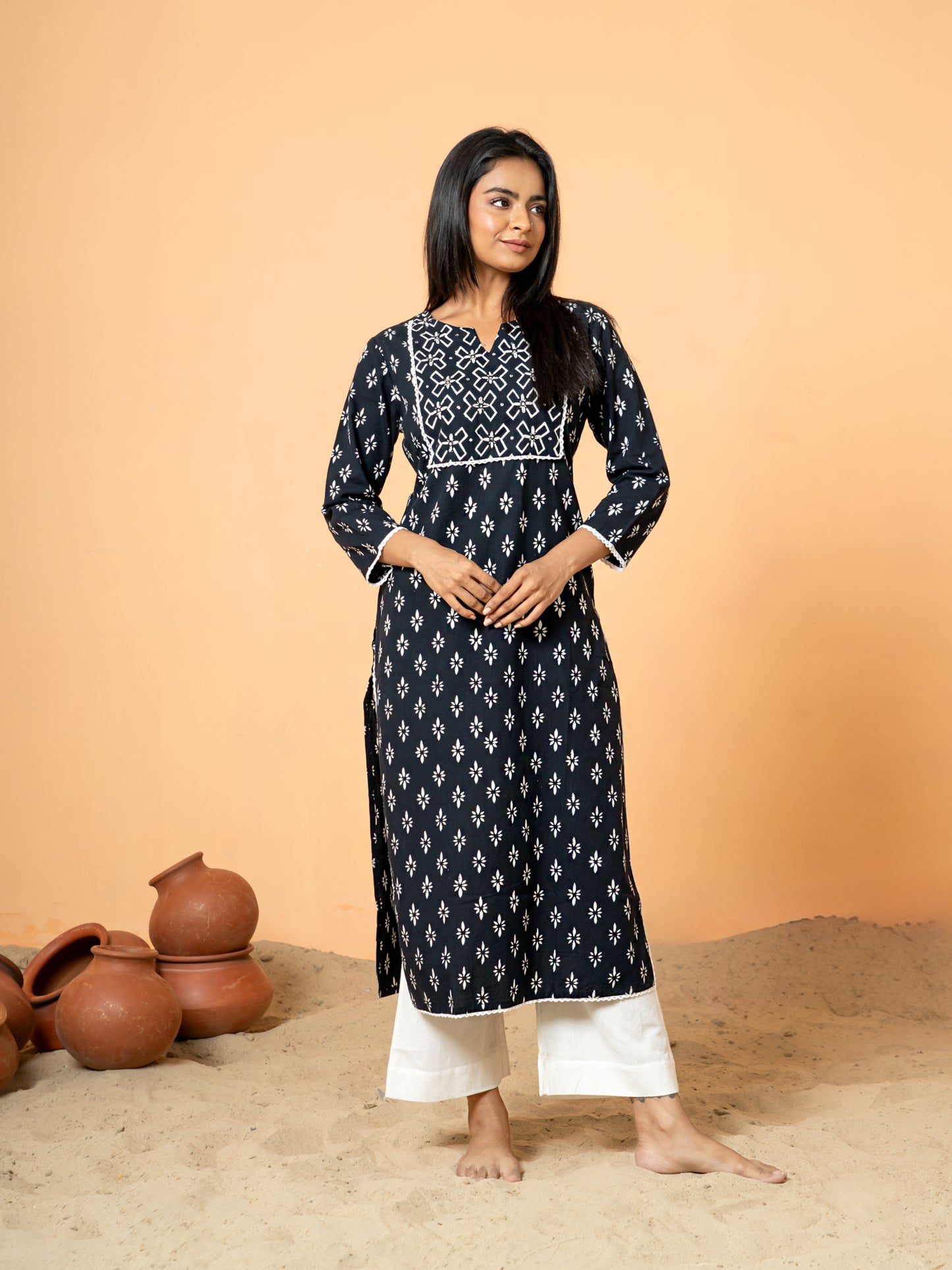 Close-up detail highlighting the intricate rangoli print and delicate lace and sequence work on the pure cotton fabric of the Black Sequence Work Kurta.