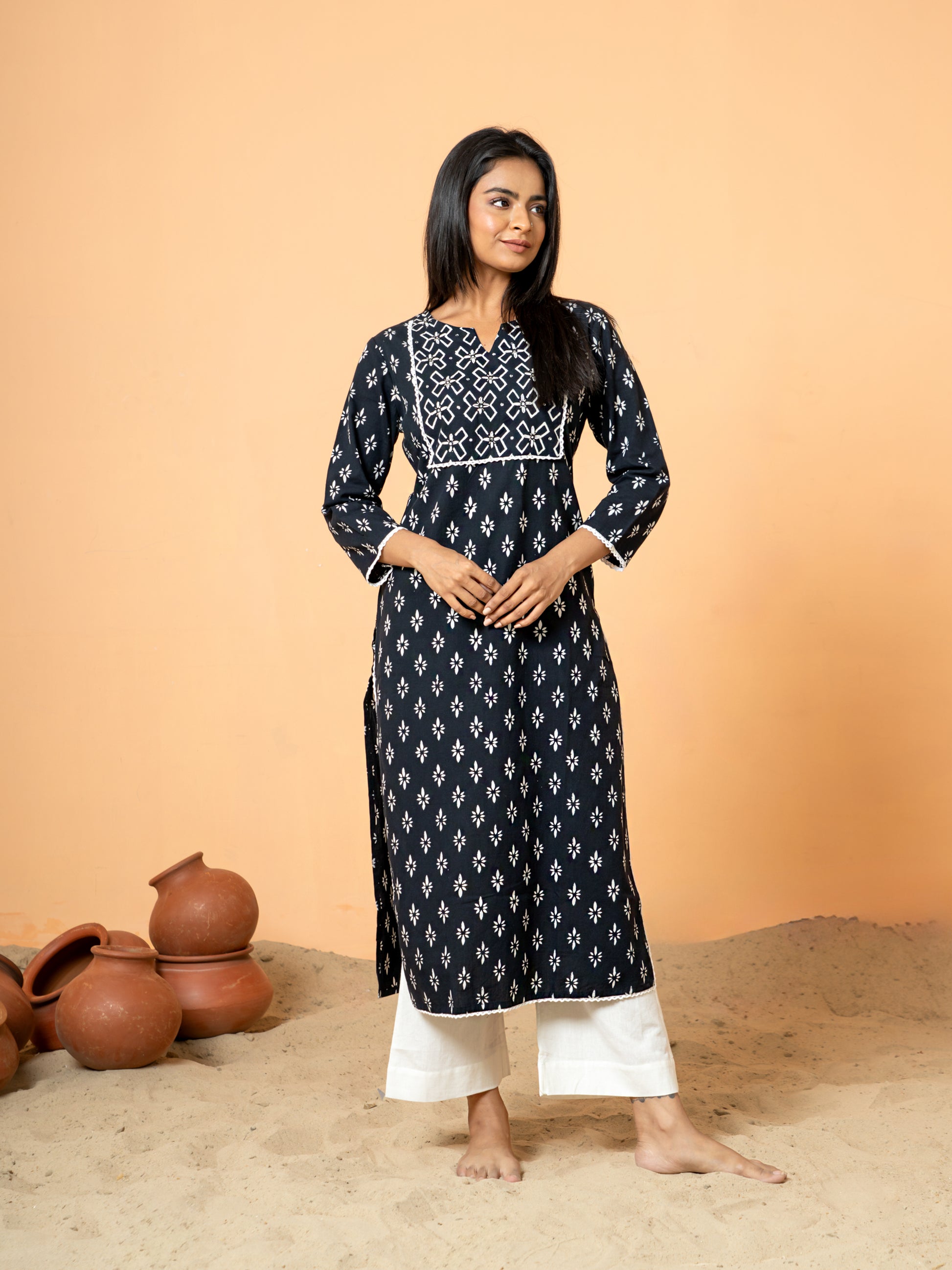 Close-up detail highlighting the intricate rangoli print and delicate lace and sequence work on the pure cotton fabric of the Black Sequence Work Kurta.