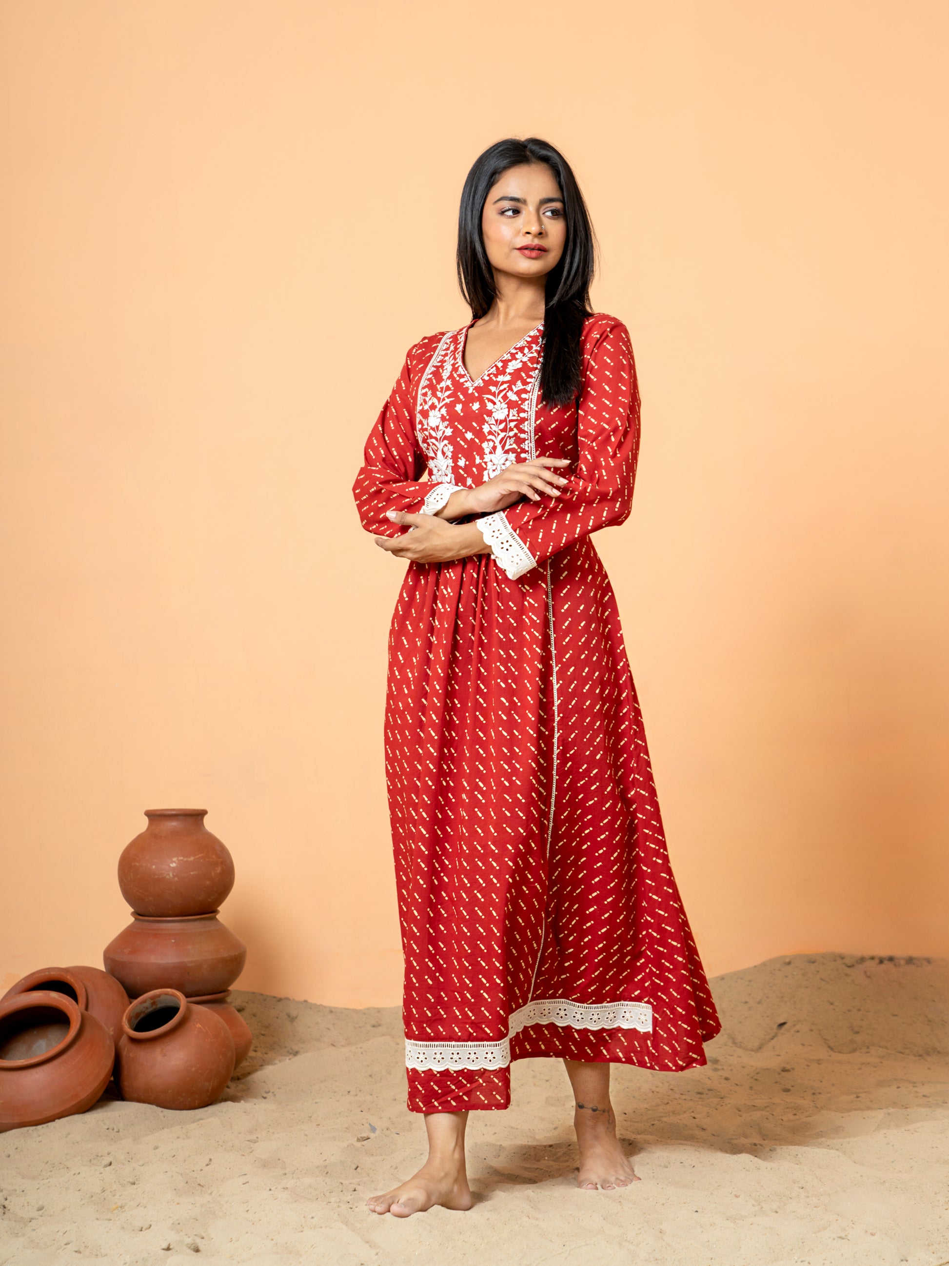 Full front view of the striking Red Lace Work Embroidered Cotton Kurta, showcasing the vibrant red color and the design with detailed embroidery and lace work near the neckline.