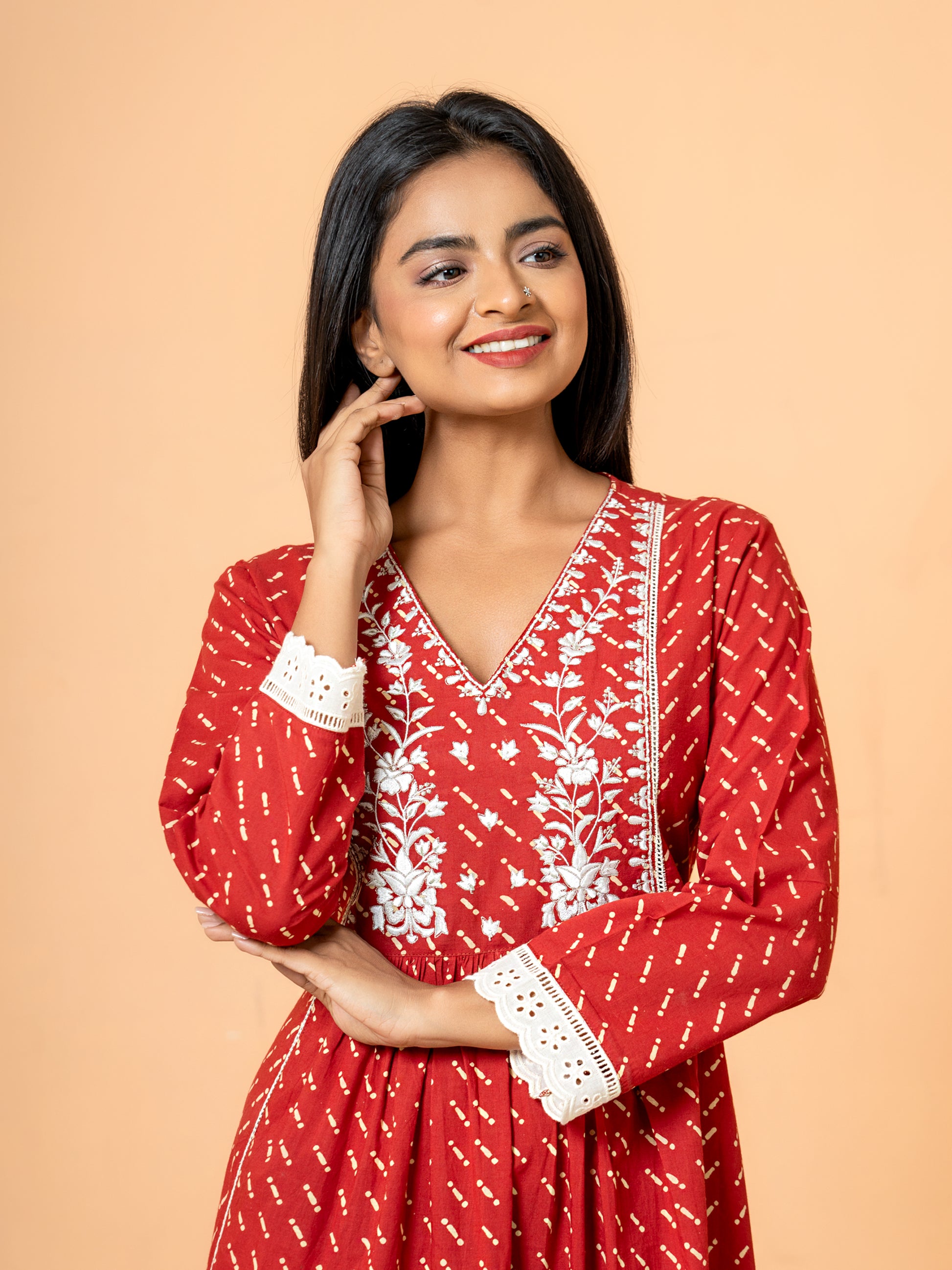 Detailed close-up focusing on the intricate embroidery and delicate white lace work that beautifully decorates the neckline and yoke area of the Red Cotton Kurta.