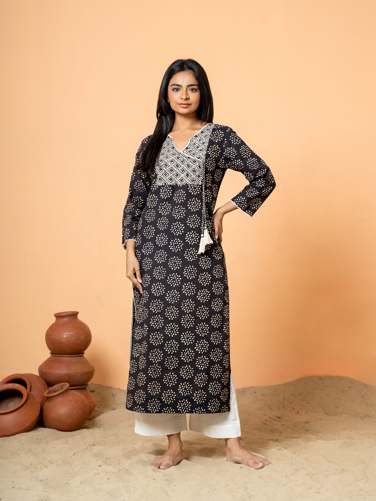 Full front view of the Black Embroidered Rangoli Print Cotton Kurta made from pure cotton with intricate embroidery.