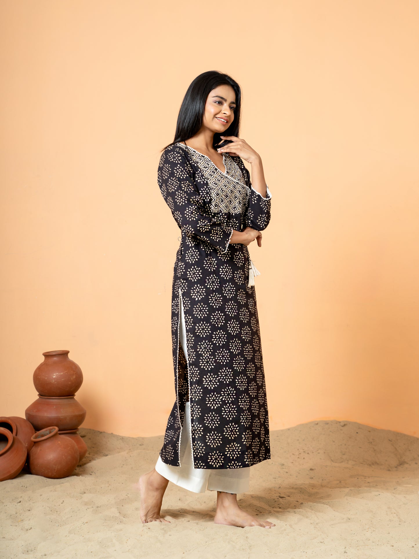 Side view showcasing the comfortable regular fit of the Black Cotton Kurta with 3/4th sleeves.