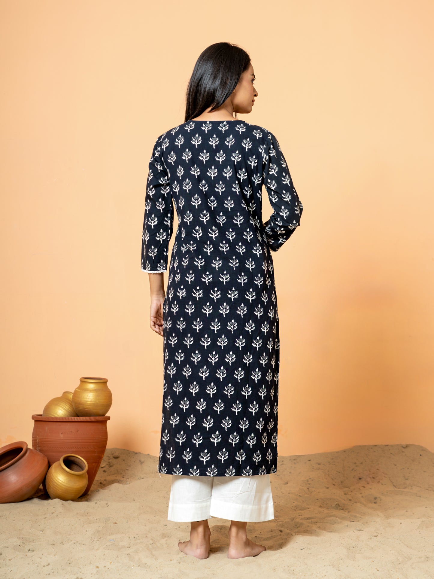 Back view of the elegant black leaf print cotton kurta.