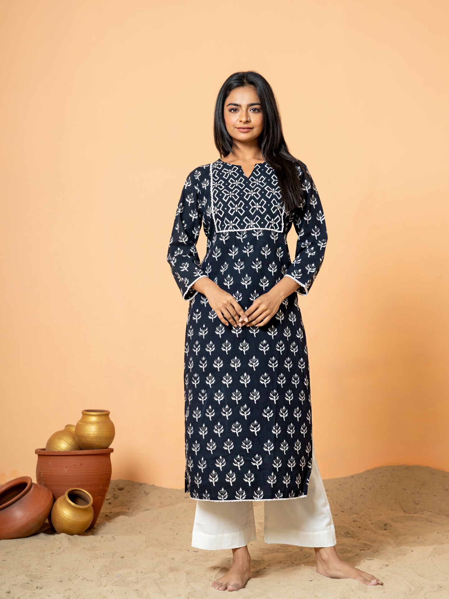 Full front view of the Black Leaf Print Lace Work Cotton Kurta for women, crafted from soft pure cotton with a striking leaf print and intricate lace detailing, featuring a round V neck.