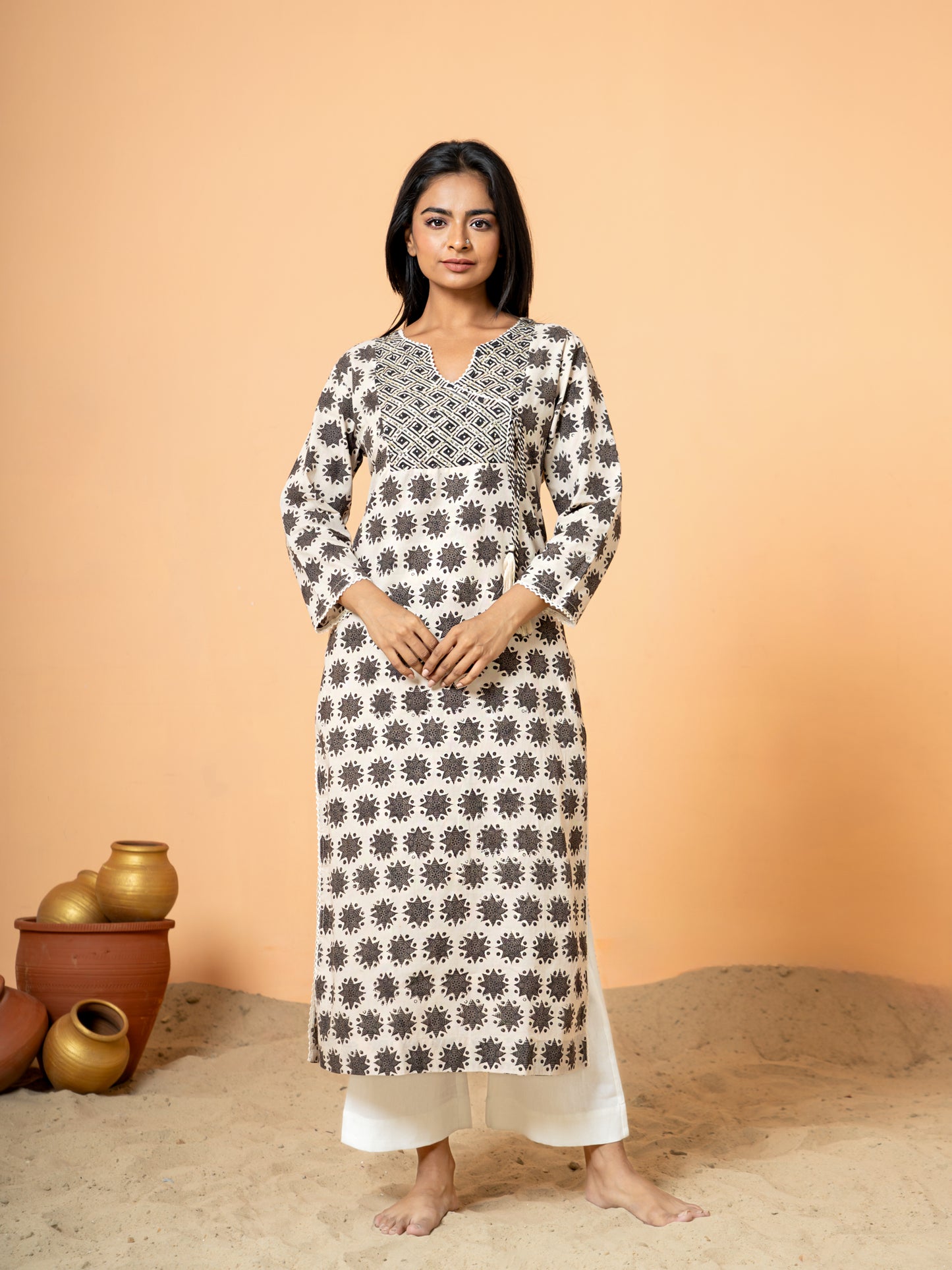 Full front view of the beautiful Cream Embroidered Rangoli Print Cotton Kurta, showcasing the soft cream cotton fabric and the striking rangoli print combined with embroidery.