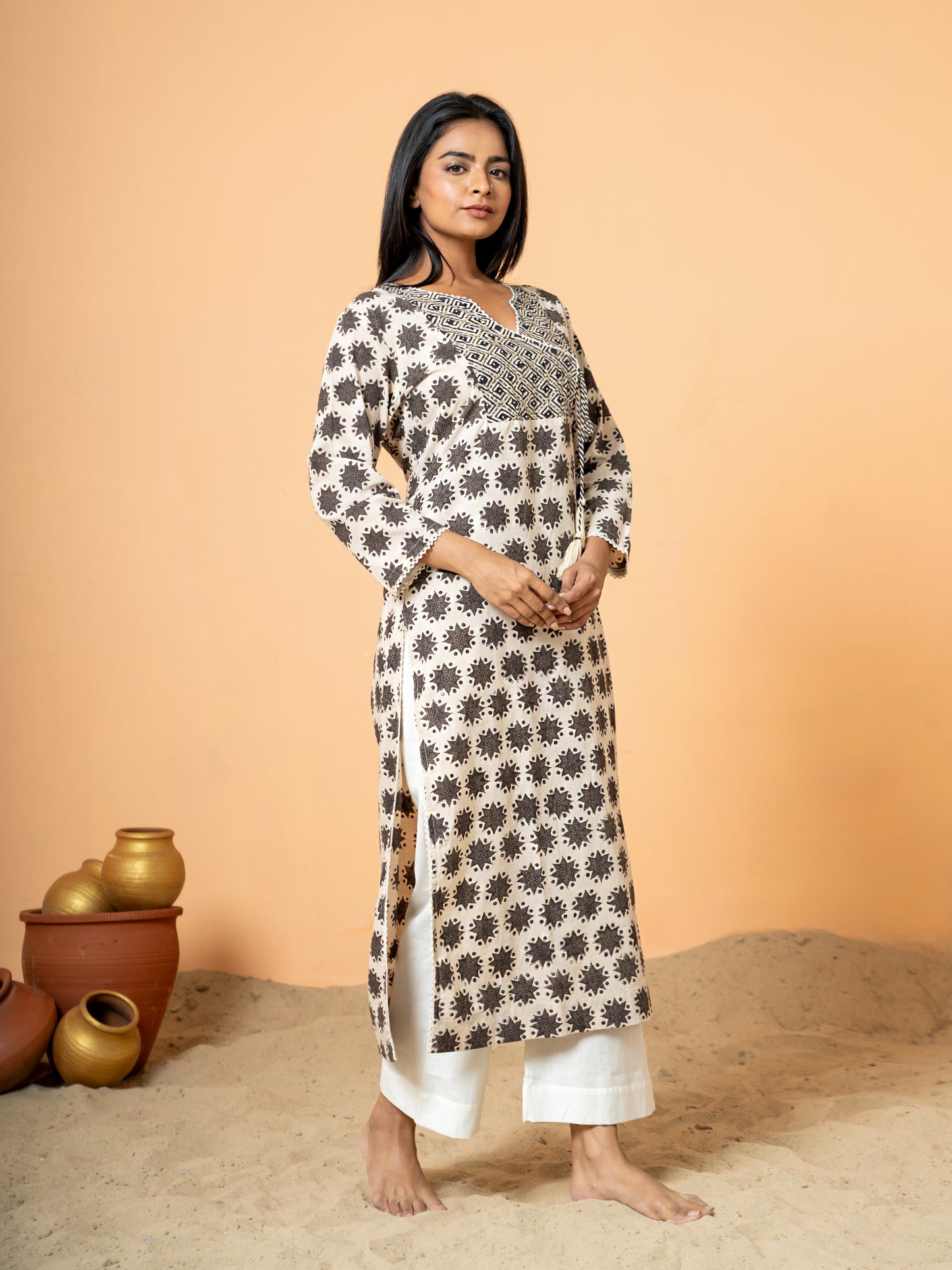 Full front view of the beautiful Cream Embroidered Rangoli Print Cotton Kurta, showcasing the soft cream cotton fabric and the striking rangoli print combined with embroidery.