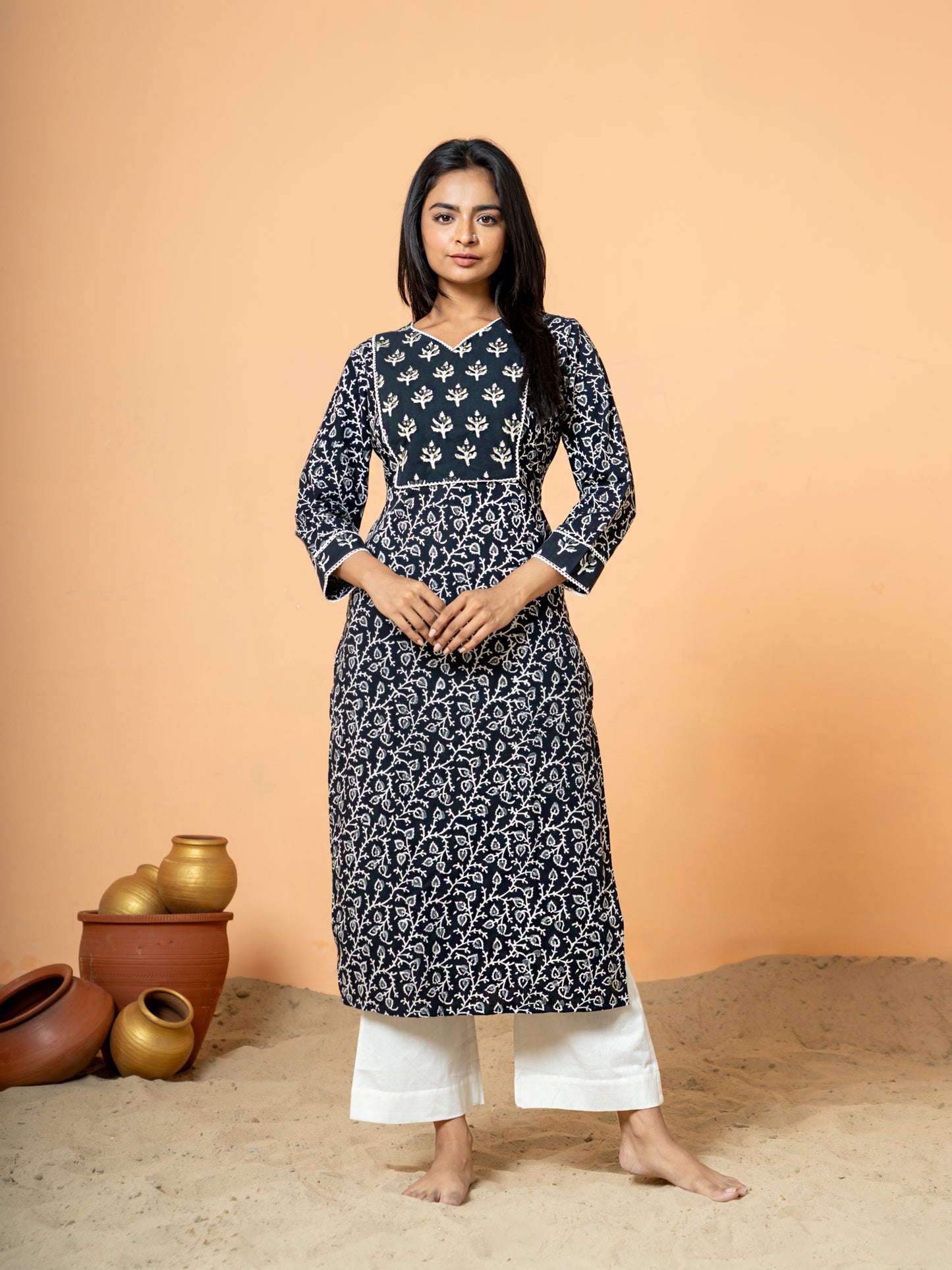 Full front view of the elegant Black Sanganeri Print Zari Work Cotton Kurta for women, showcasing the traditional Sanganeri print on soft pure cotton with intricate zari and sequence detailing, featuring a V neck and 3/4th sleeves.