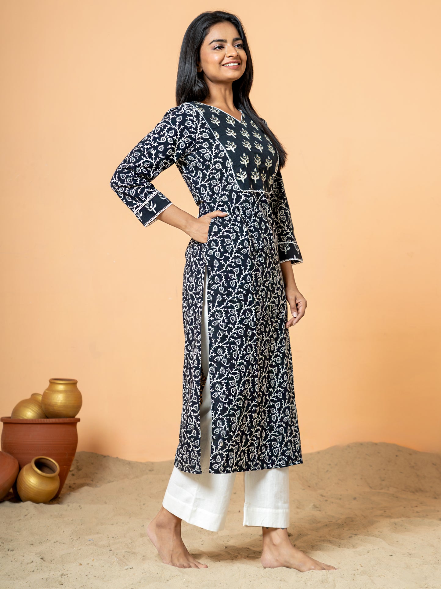 Side view of the Black Sanganeri Print Zari Work Cotton Kurta, ideal for festive gatherings or everyday elegance, highlighting its design details.