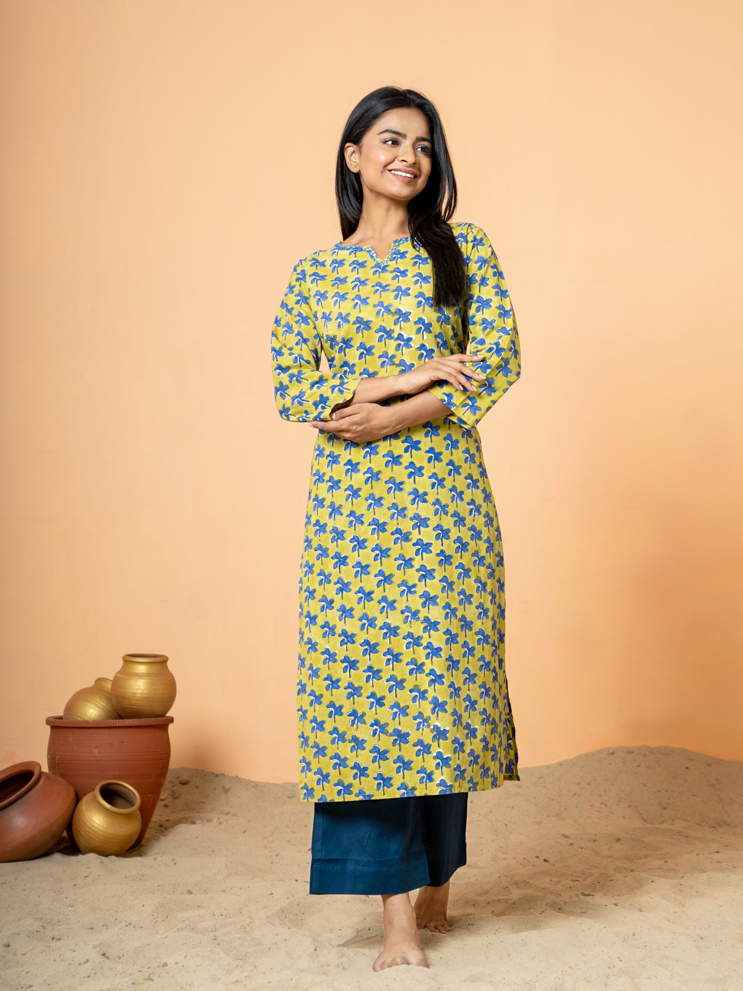 Full front view of the elegant Green Nayantara Printed Cotton Kurta for women, showcasing the beautiful handblock Nayantara prints and delicate Katha work on breathable pure cotton fabric, featuring a Round V Neck and 3/4th sleeves.