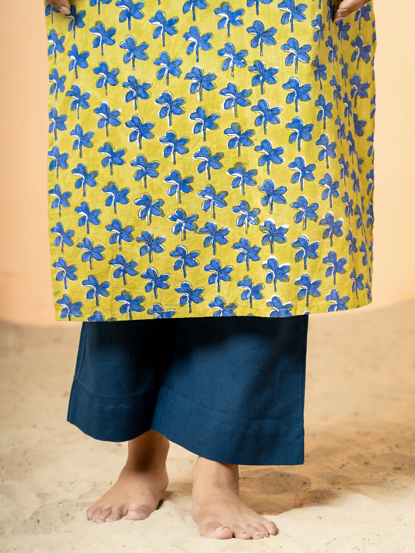 Close-up detail highlighting the intricate handblock Nayantara prints and delicate Katha work on the pure cotton fabric of the Green Printed Kurta.