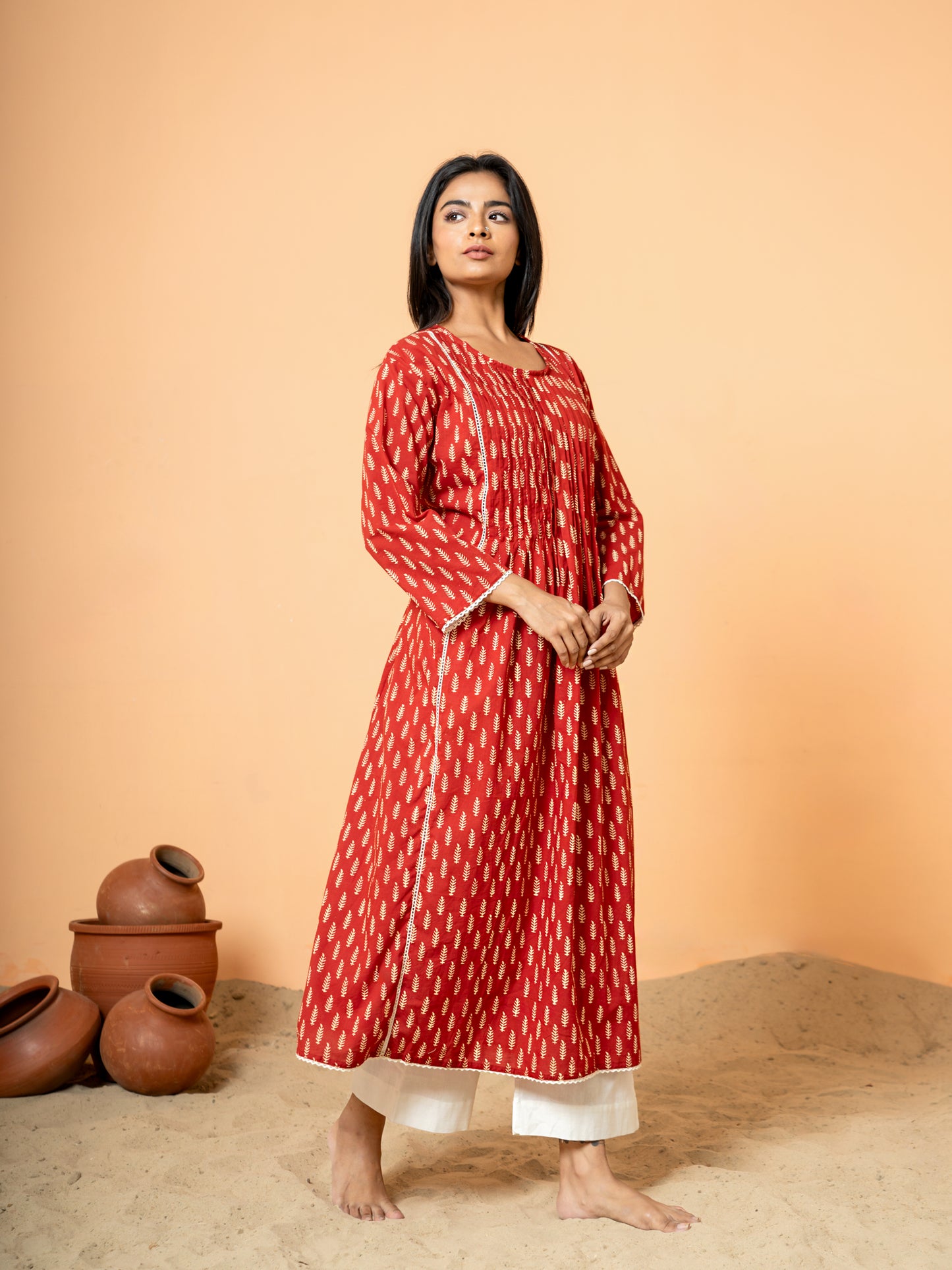 Image showing the full length and drape of the Red Palm Leaf Printed Cotton Kurta, highlighting the pure cotton comfort and the distribution of the elegant leaf prints.