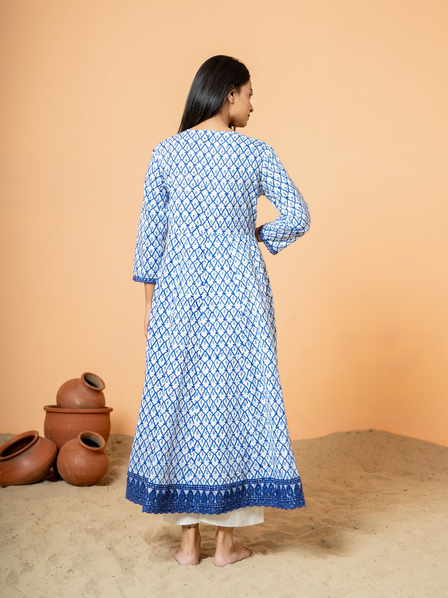 Back view revealing the natural texture of the soft blue cotton fabric with visible handblock printing imperfections, highlighting authenticity.