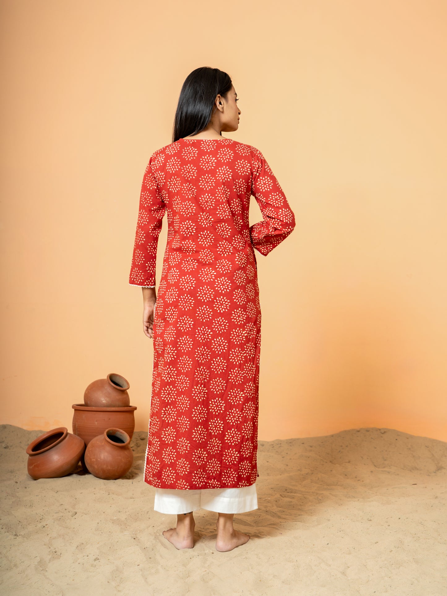Back view of the versatile Red Embroidered Rangoli Print Cotton Kurta for women.