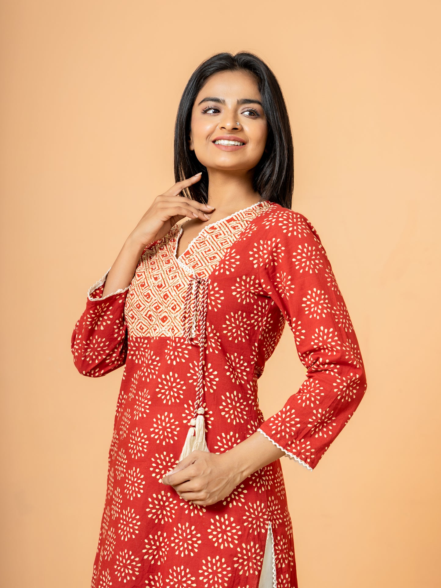 Detailed view of the delicate embroidery work on the Red Embroidered Rangoli Print Cotton Kurta.