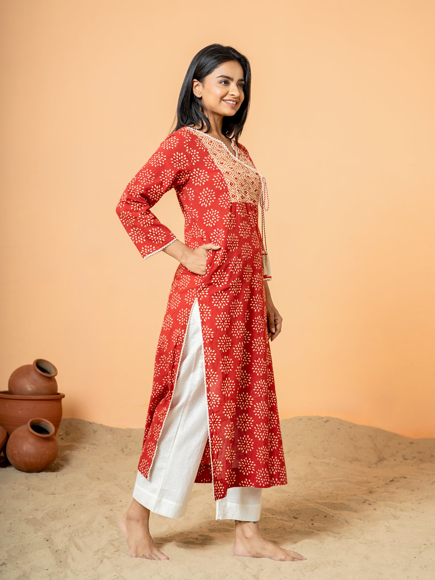 Side view showcasing the comfortable regular fit of the Red Cotton Kurta with 3/4th sleeves.