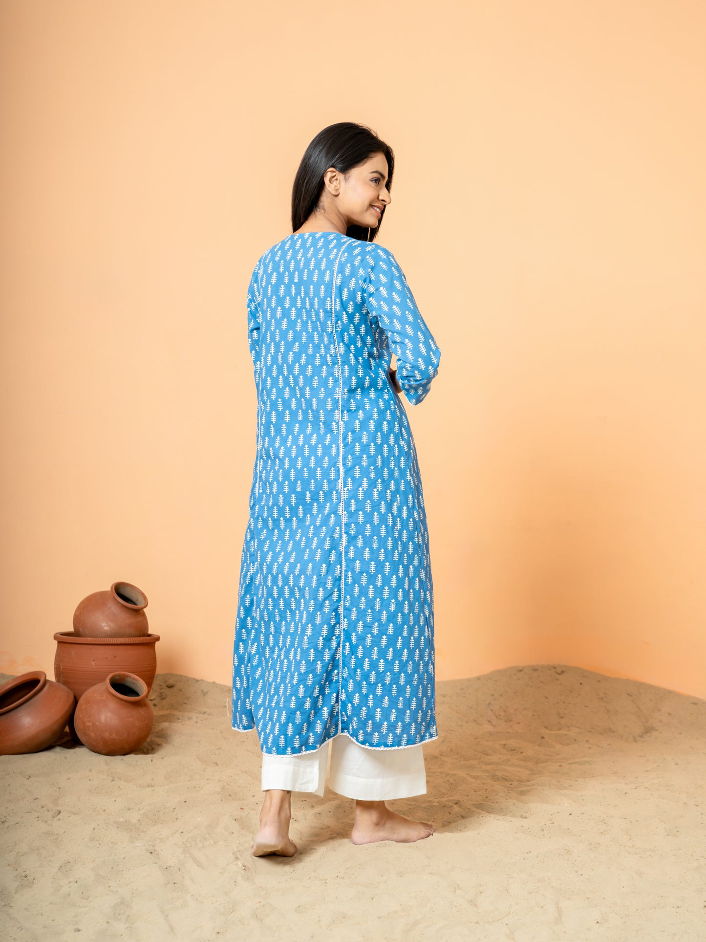 Back view of the Blue Palm Leaf Printed Cotton Kurta, emphasizing its unique blue hue and intricate leaf print design, ideal for festive occasions and party wear.