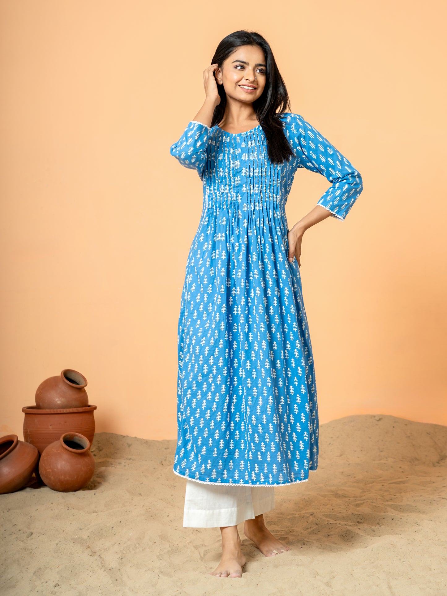 Image showing the full length and drape of the Blue Palm Leaf Printed Cotton Kurta, highlighting the pure cotton comfort and the distribution of the elegant leaf prints.
