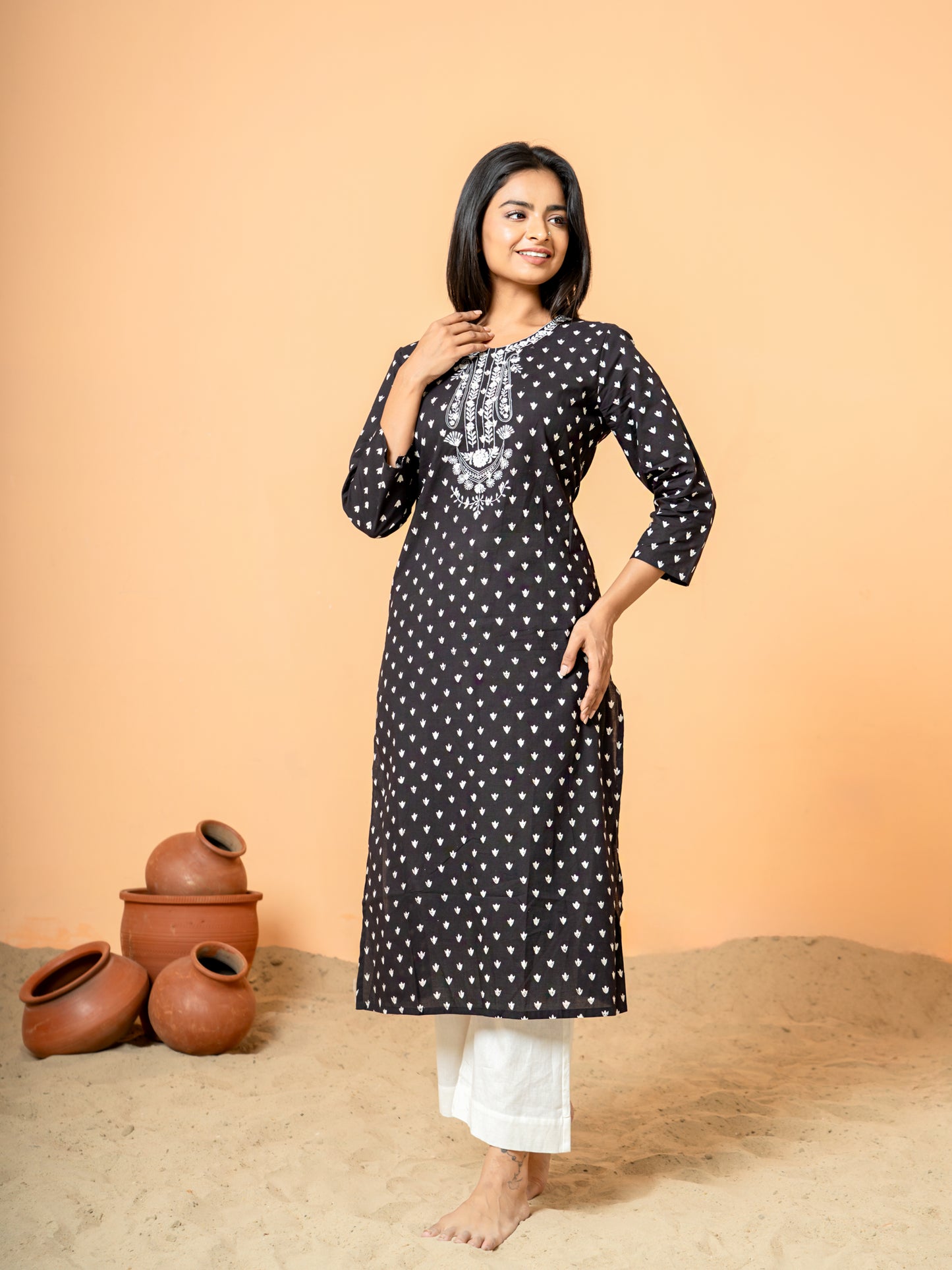 Stylish shot showing the Elegant Black Embroidered Cotton Kurta being worn, suitable for festive occasions or party wear.