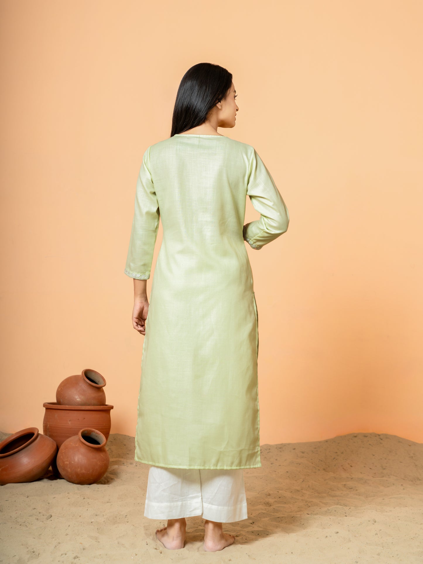 Back view of Pretty Pista Embroidered Straight Cotton Kurta, highlighting the elegant design and straight cut of this stylish women's kurta.