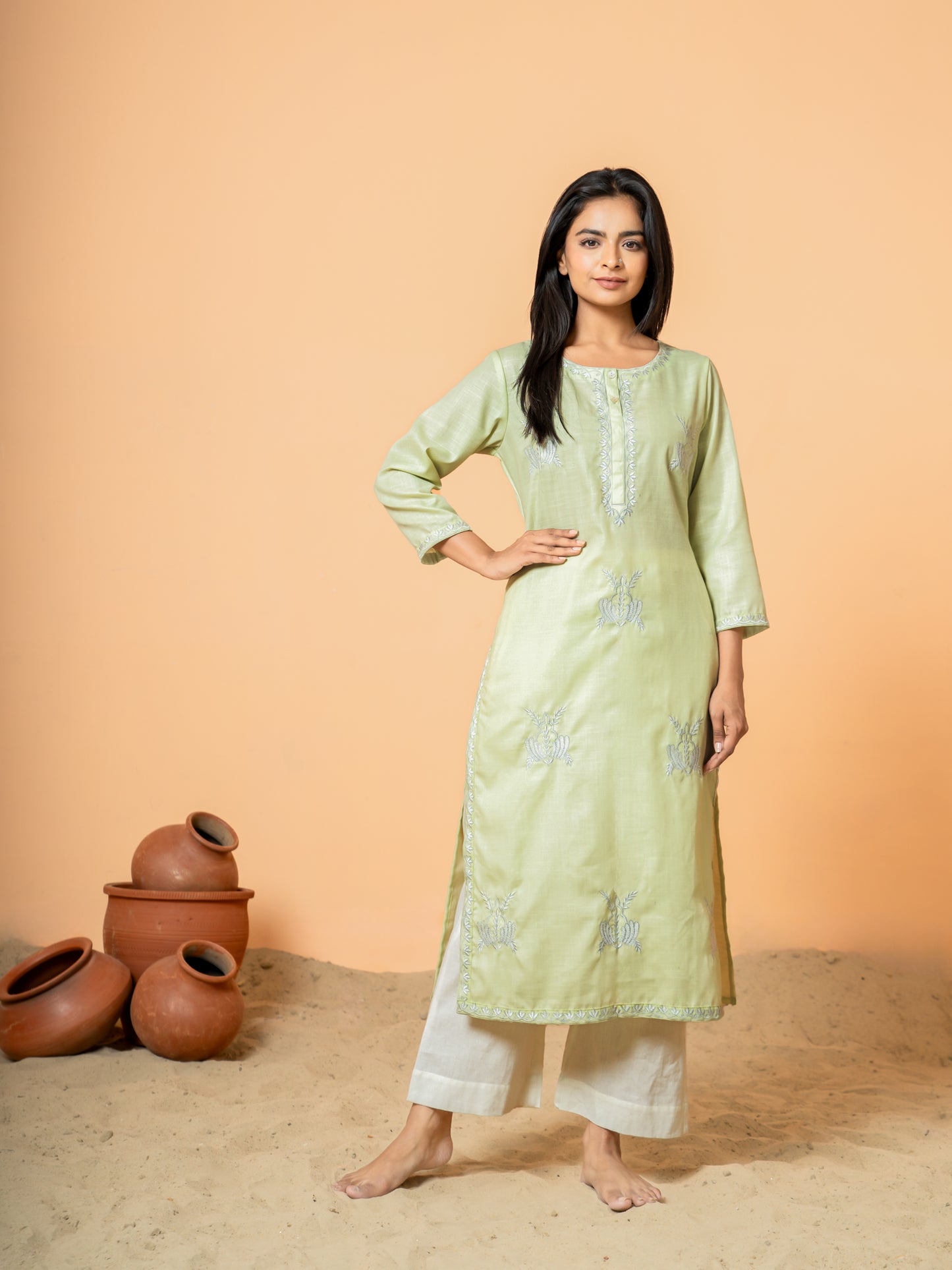 Detailed view of the soft, breathable pure cotton fabric of the Pretty Pista Embroidered Kurta, ensuring all-day comfort for women.