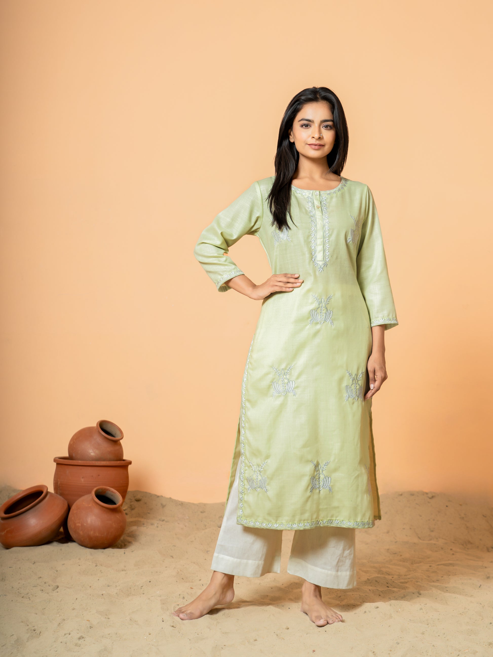 Detailed view of the soft, breathable pure cotton fabric of the Pretty Pista Embroidered Kurta, ensuring all-day comfort for women.