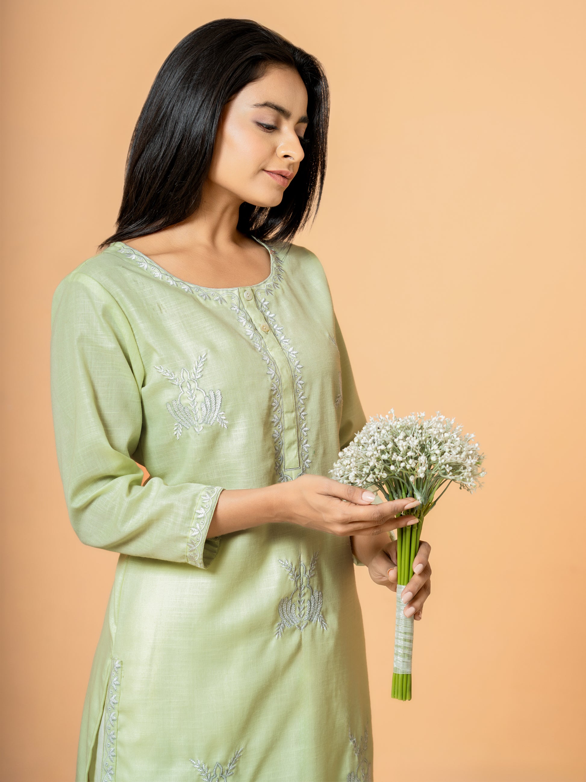 Close-up of the delicate embroidery on the Pretty Pista Straight Cotton Kurta, emphasizing the designer touch on this pista green kurta.