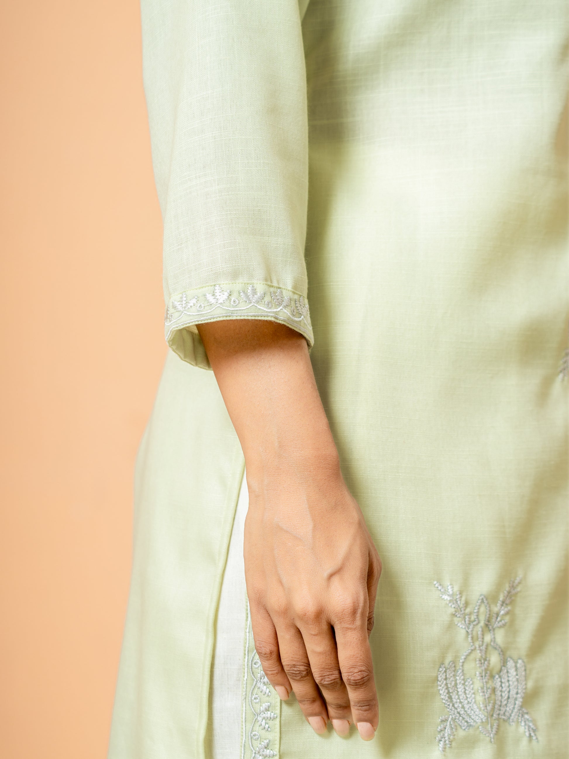 Detail of the 3/4th sleeves on the Pretty Pista Embroidered Cotton Kurta, illustrating the versatile and chic design suitable for any occasion.