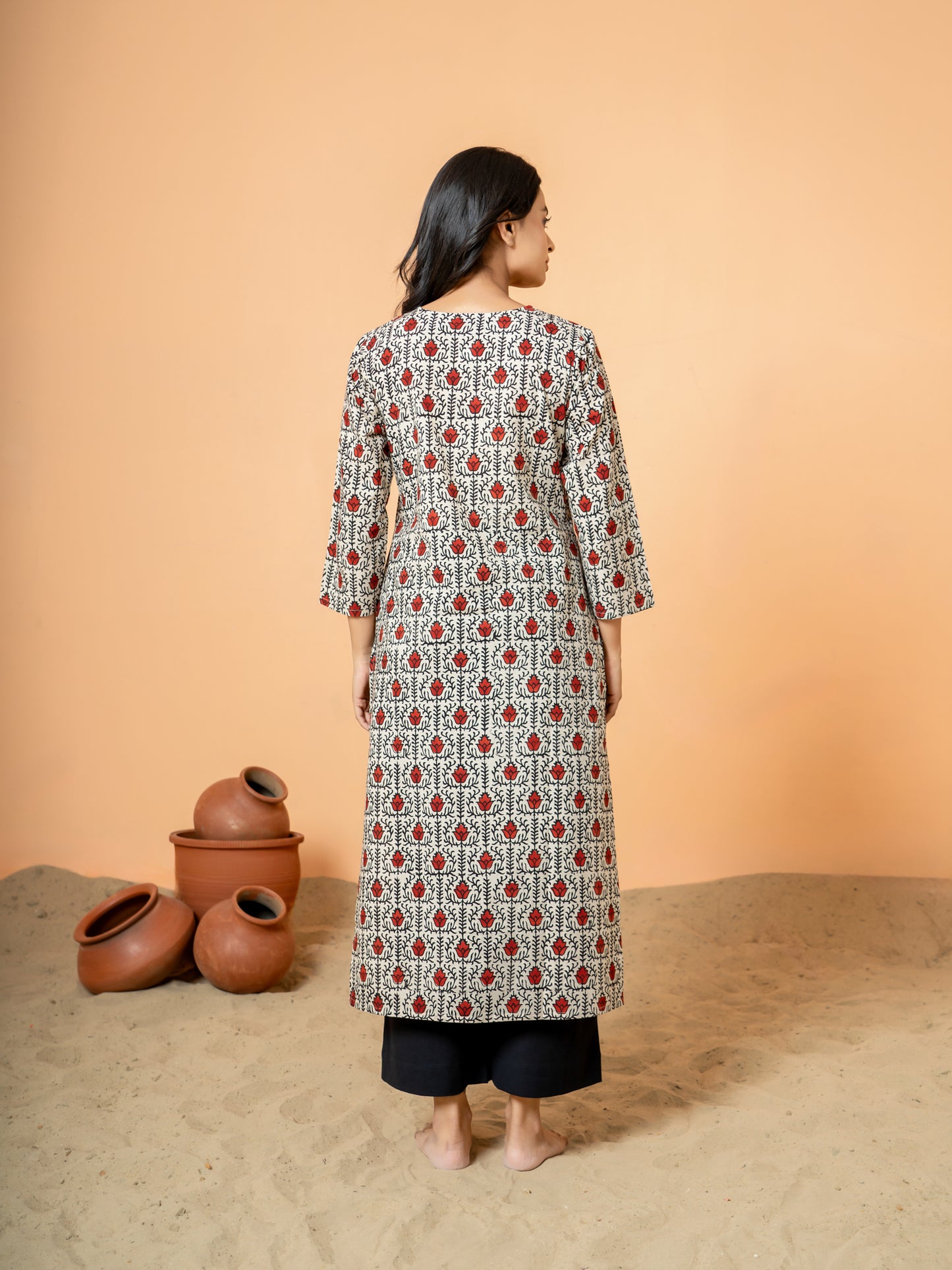 Back view of the elegant Cream Cotton Kurta with lotus handblock print.