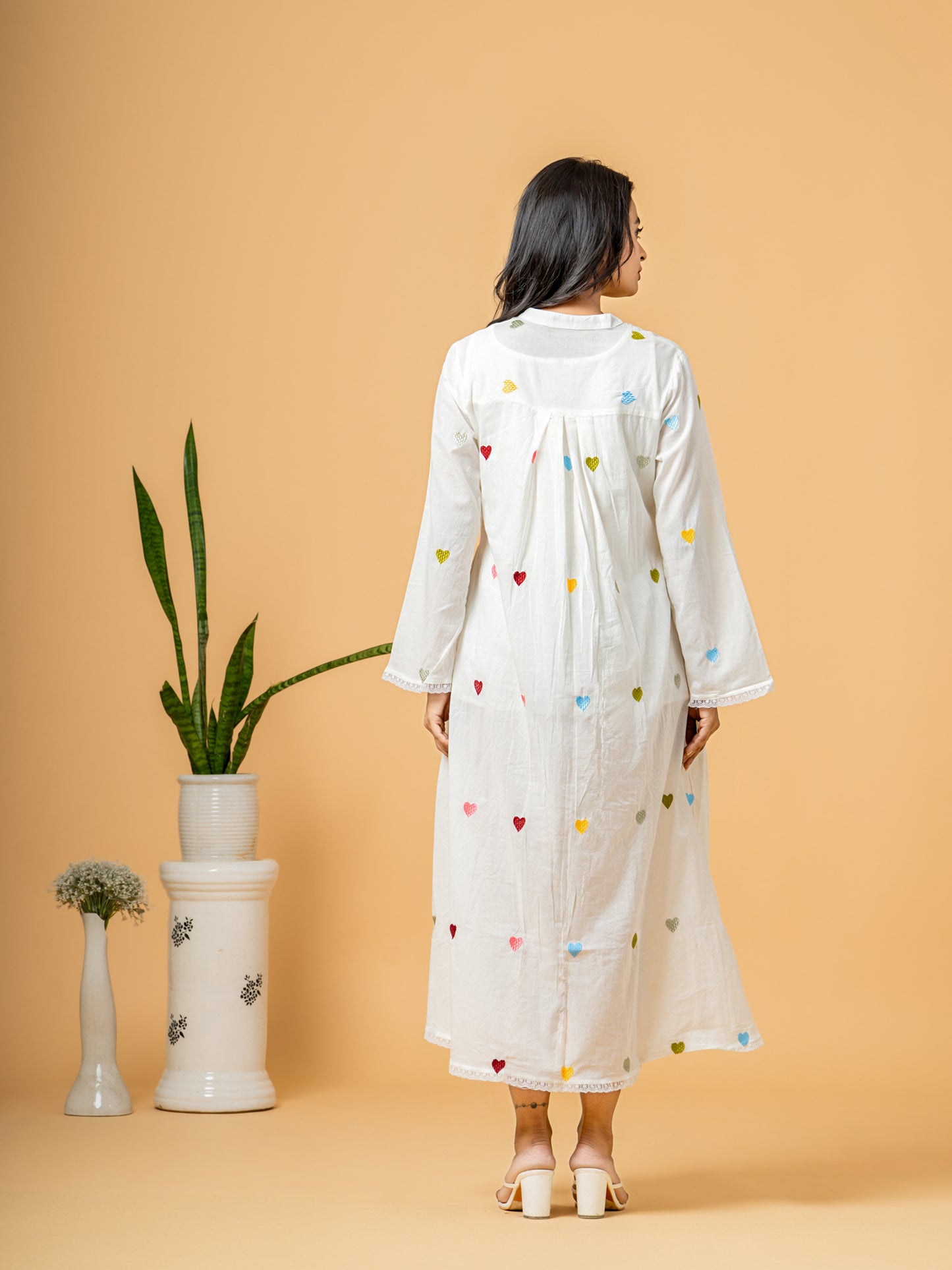 Back view of the Rich White Good Heart Cotton Kurta by Cottons Daily, showcasing the continuous heart print design on soft, breathable pure cotton fabric.