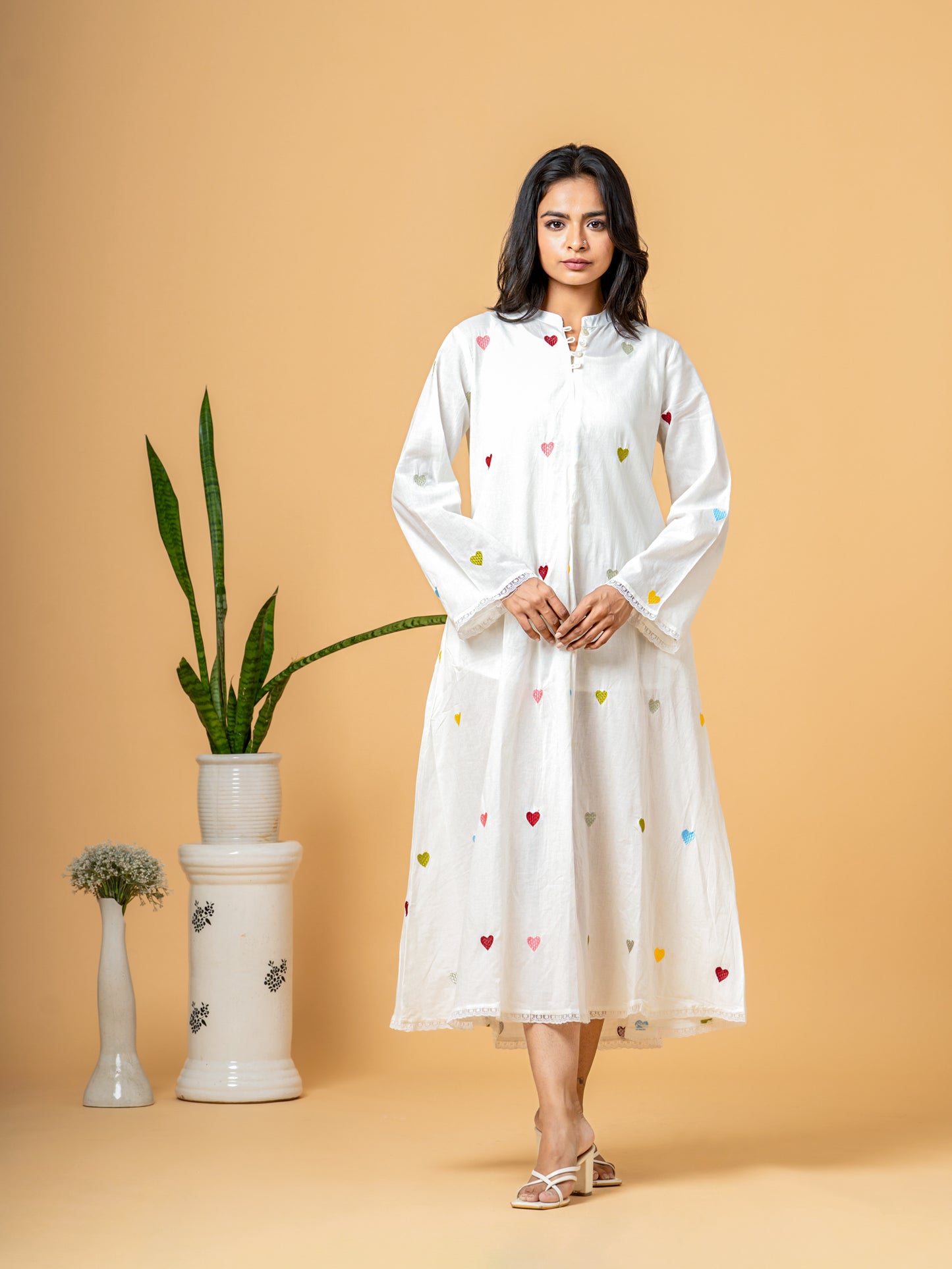Full front view of the elegant Rich White Good Heart Cotton Kurta for women, showcasing the charming heart print, chic Mandarin Collar, and 3/4th sleeves on soft, breathable pure cotton fabric.