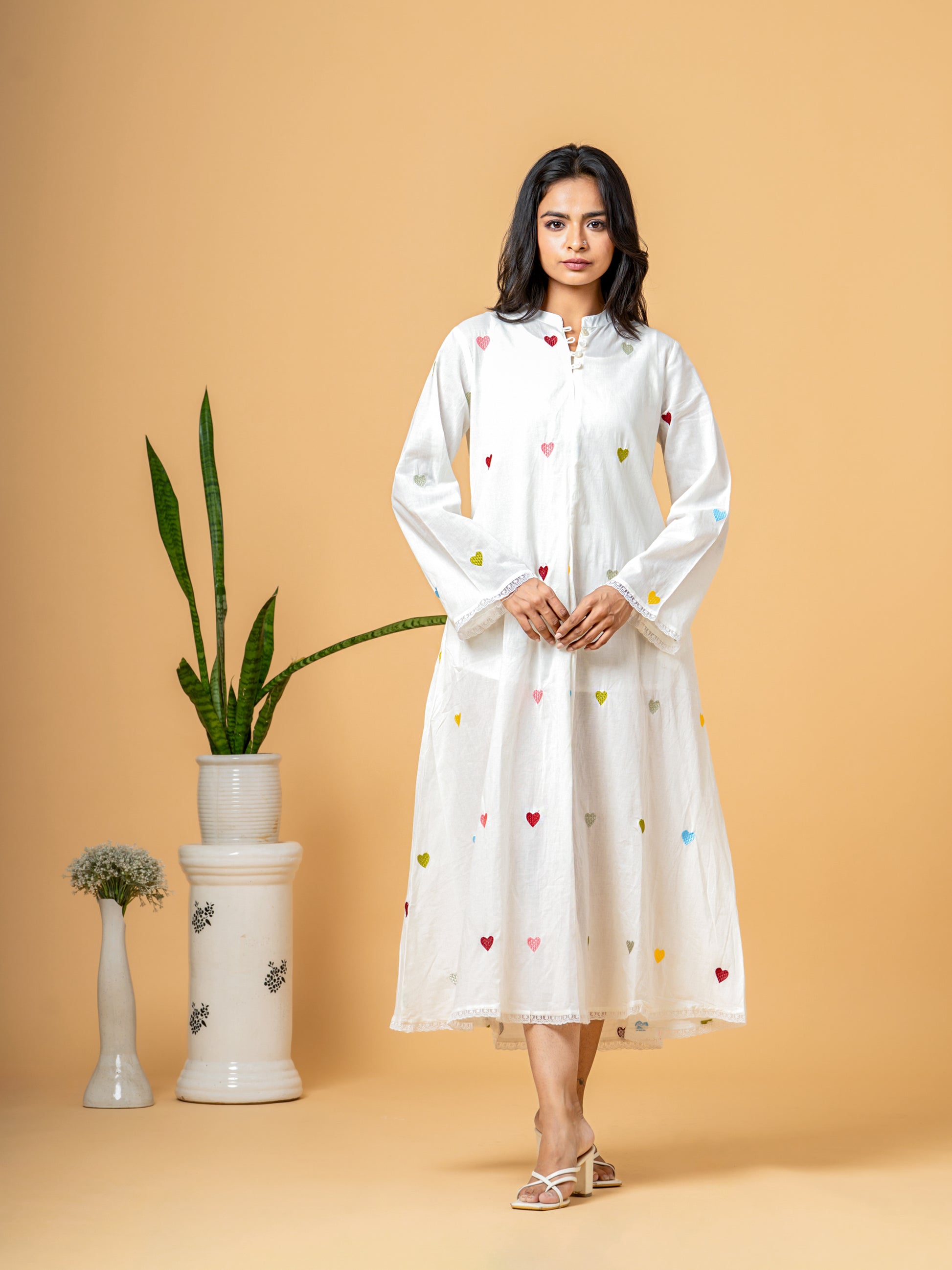 Full front view of the elegant Rich White Good Heart Cotton Kurta for women, showcasing the charming heart print, chic Mandarin Collar, and 3/4th sleeves on soft, breathable pure cotton fabric.