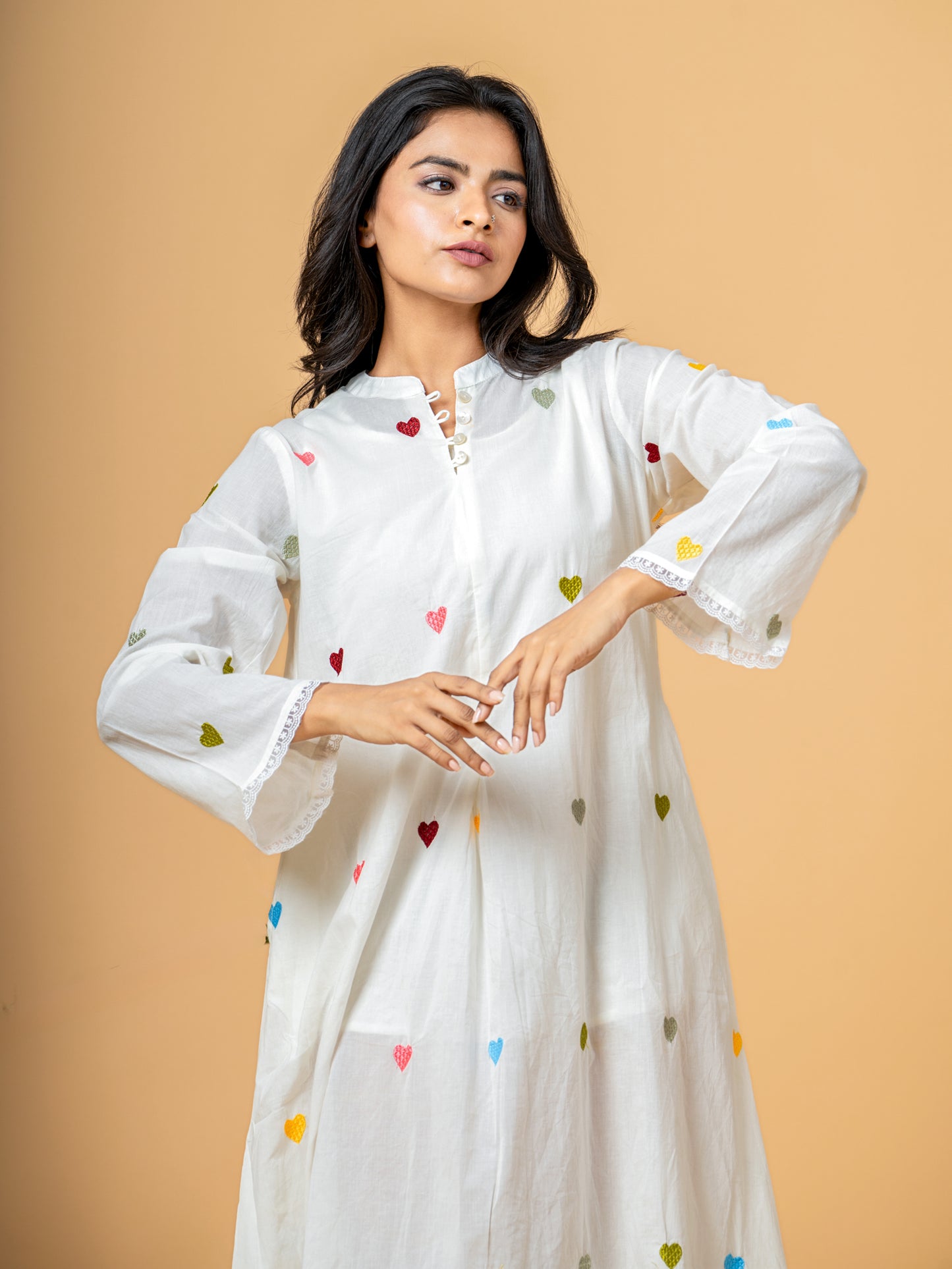 Close-up detail highlighting the delightful Charming Heart Print on the soft, pure cotton fabric of the Rich White Good Heart Cotton Kurta.