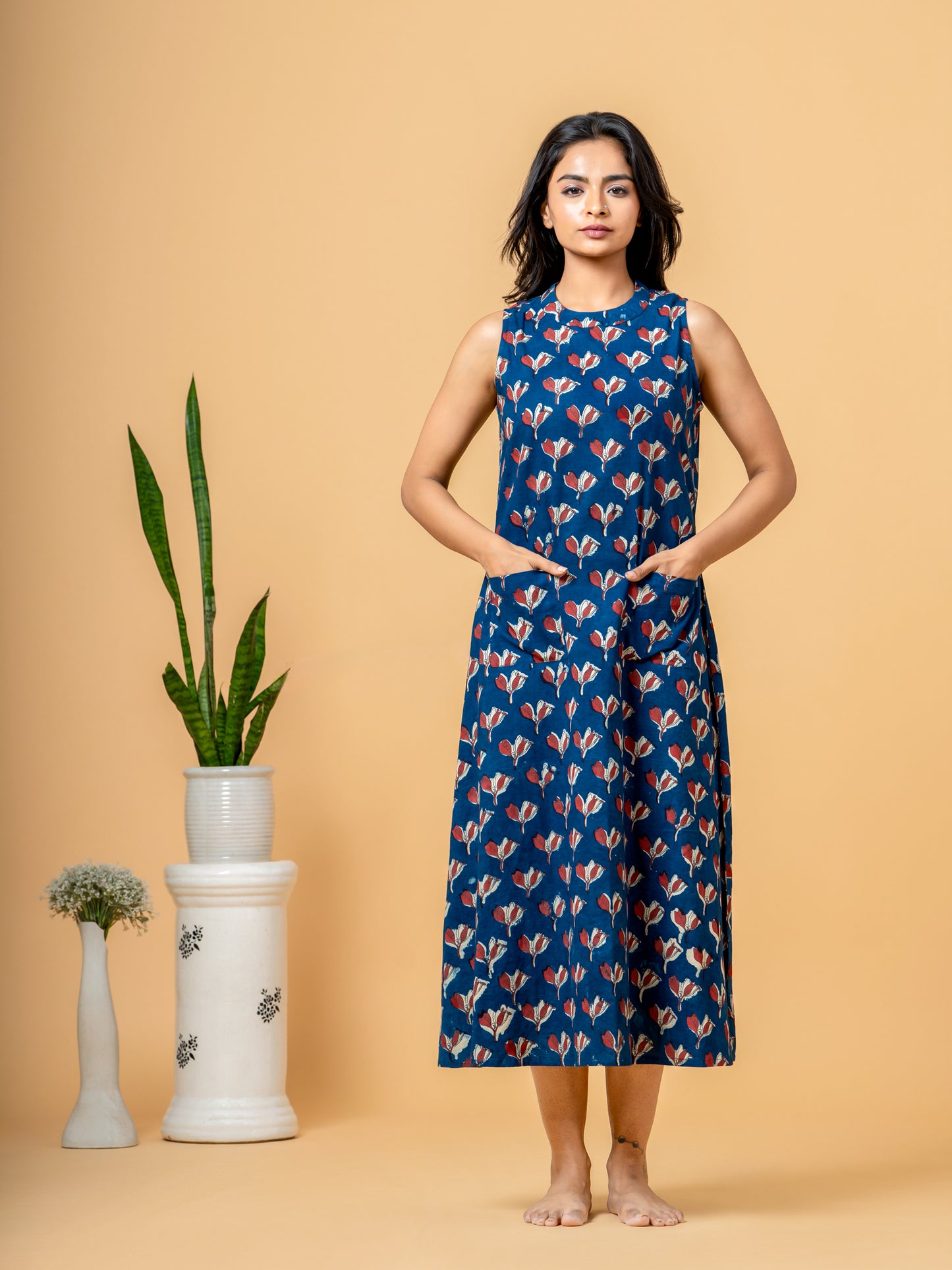 Full front view of the Stylish Indigo Floral A-line Cotton Kurta, showcasing the vibrant indigo color and all-over floral print, highlighting its flattering A-line silhouette.
