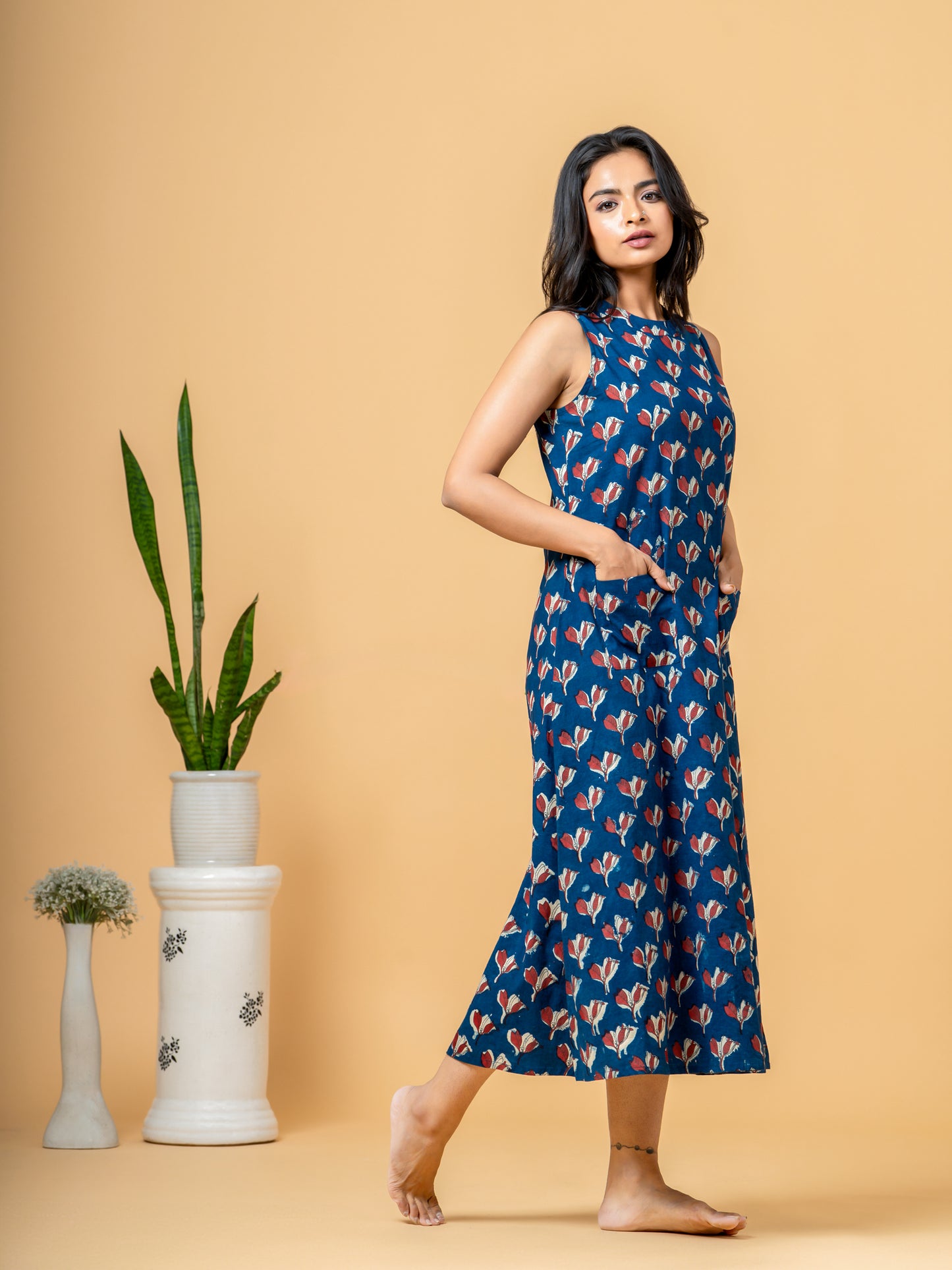 Side profile view of the Stylish Indigo Floral A-line Cotton Kurta, demonstrating the comfortable A-line fit and how the indigo floral print drapes.