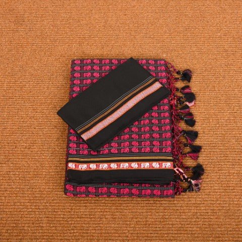 Neatly folded Abha Rani Pink Hati Mor Cotton Khun Saree, revealing the luxurious texture of Mercerised Cotton Khun fabric. The vibrant pink Hathi Mor weave stands out beautifully against the black background, making it a signature piece from Cottons Daily.