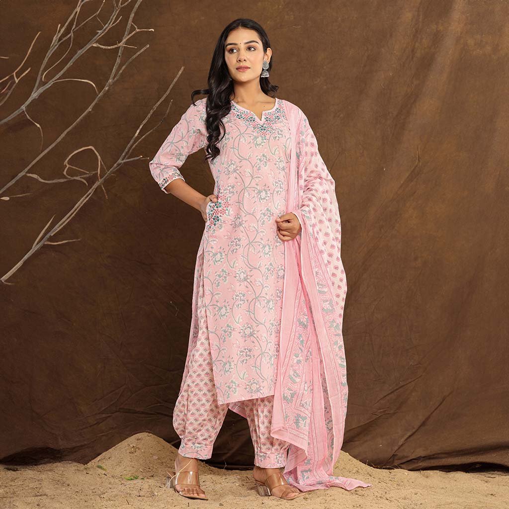 Side View: Side profile of the Baby Pink Lotus Printed Afghani Cotton Suit, highlighting the Afghani-style printed pants and the flowing printed dupatta.