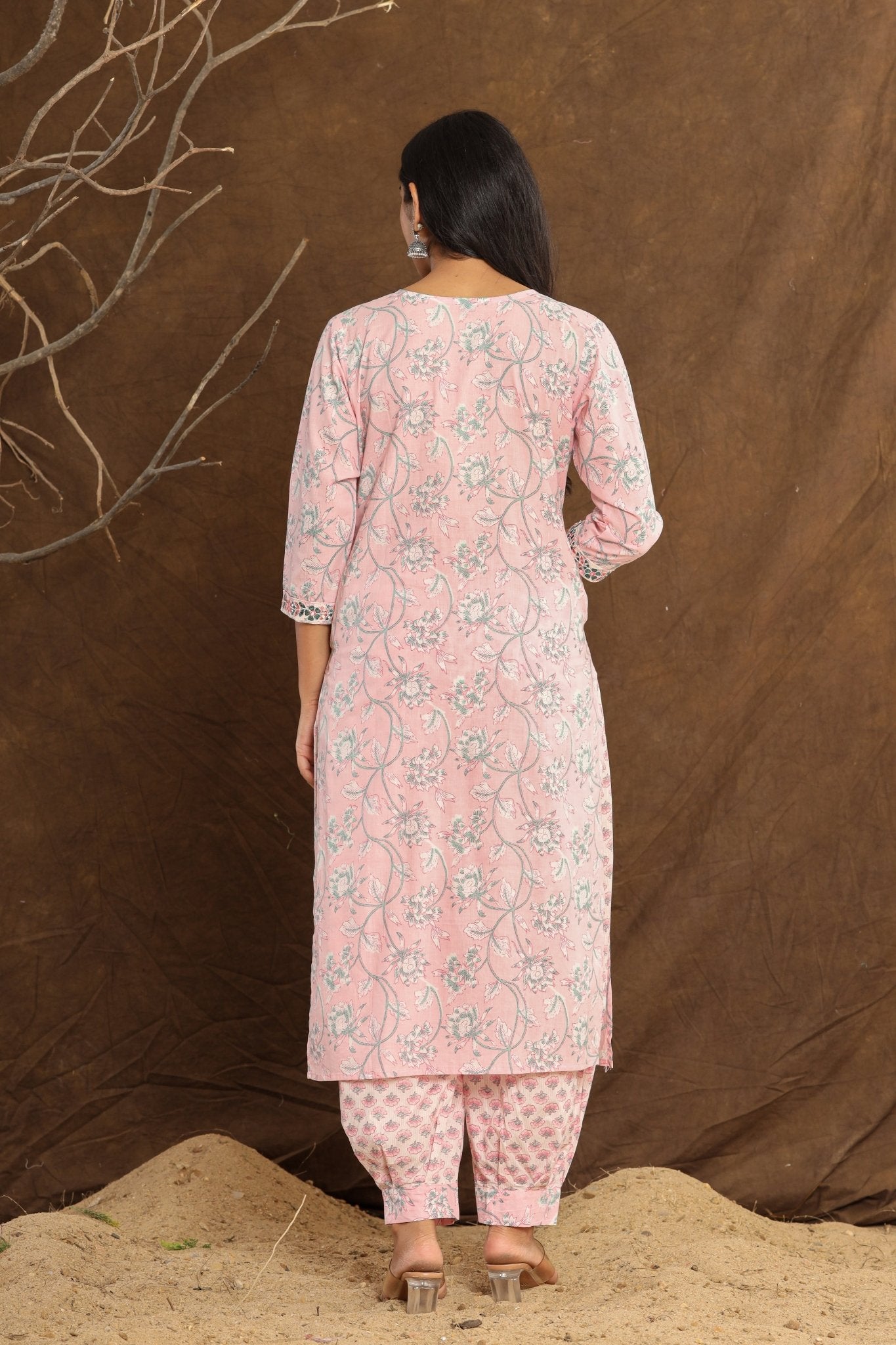 Back View: Rear view of the Baby Pink Lotus Printed Afghani Cotton Suit, showcasing the back design of the kurta and the drape of the printed dupatta.