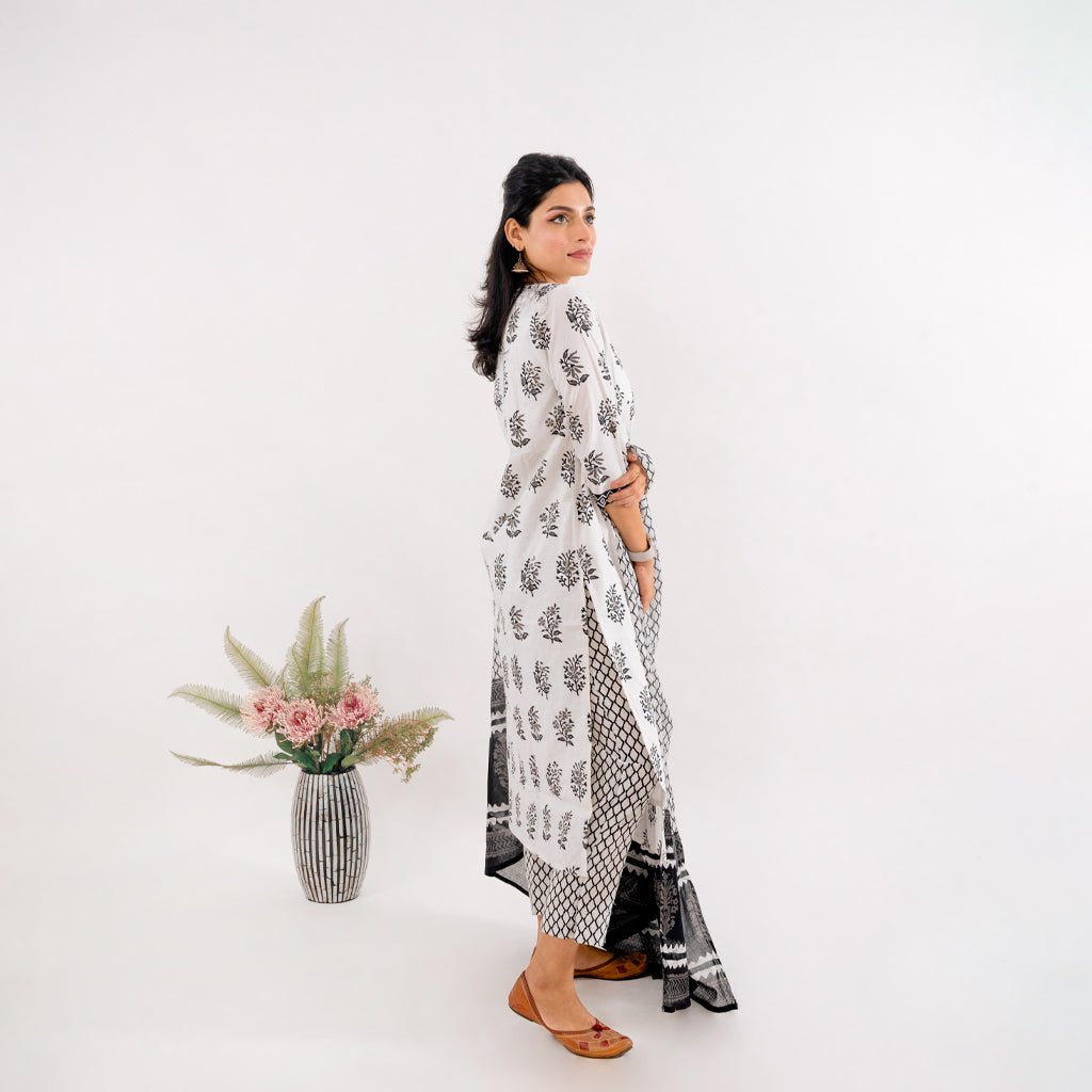 Side profile of the Black & White Printed Cotton Suit from Cottons Daily, displaying the 3/4th sleeve length and side detailing.