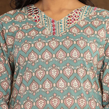 Detailed view of the Afghani-style pants in the Teal Leaf Printed Cotton Suit, displaying the teal leaf print and gotta patti border, exemplifying Cottons Daily's attention to detail.